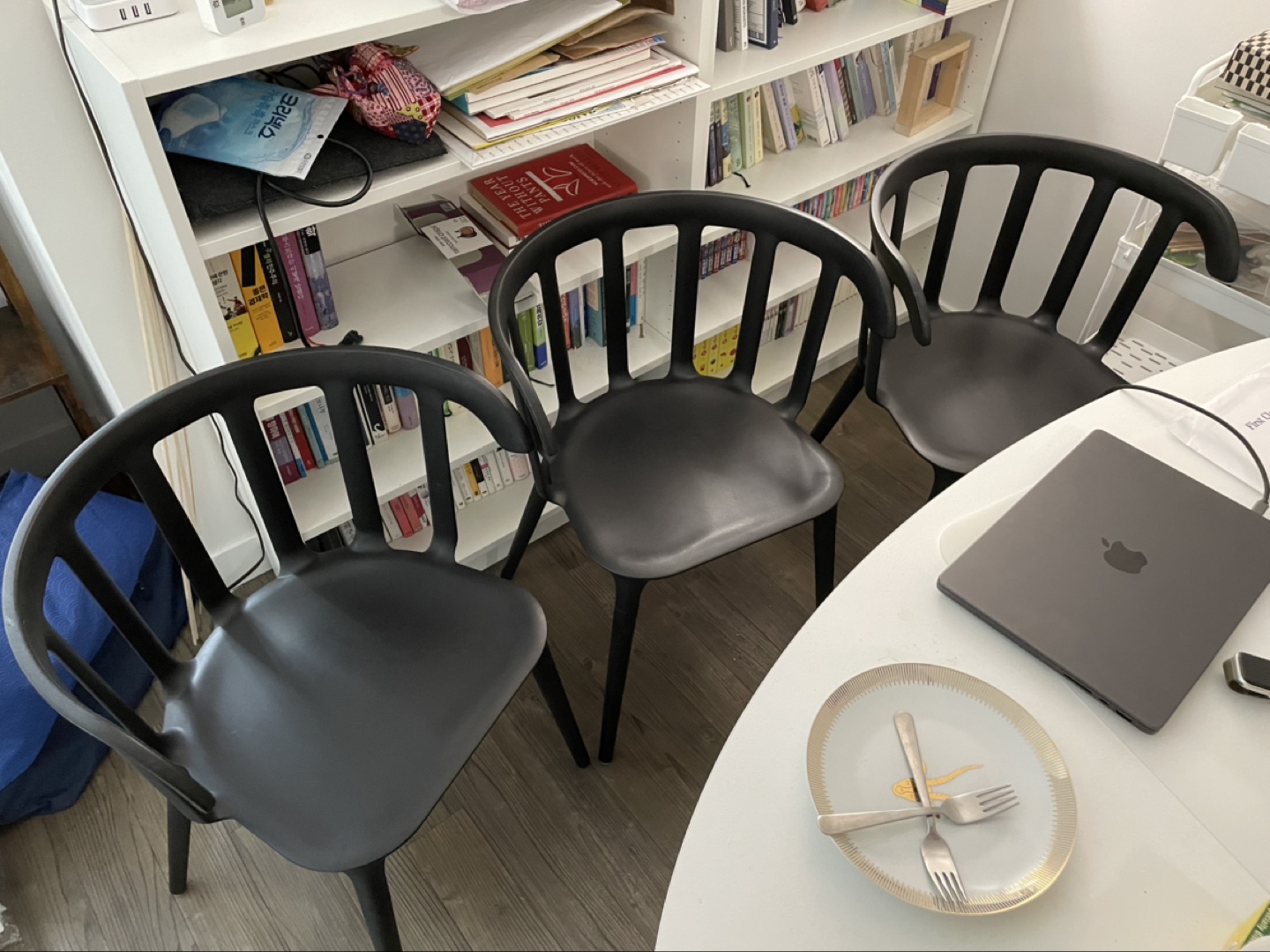 Set of three black plastic chairs