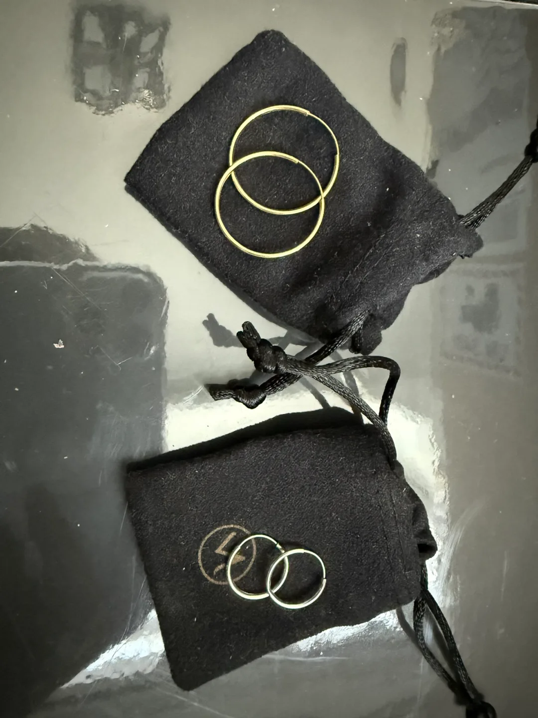 Two Pairs of Gold and white gold Hoop Earrings thumbnail