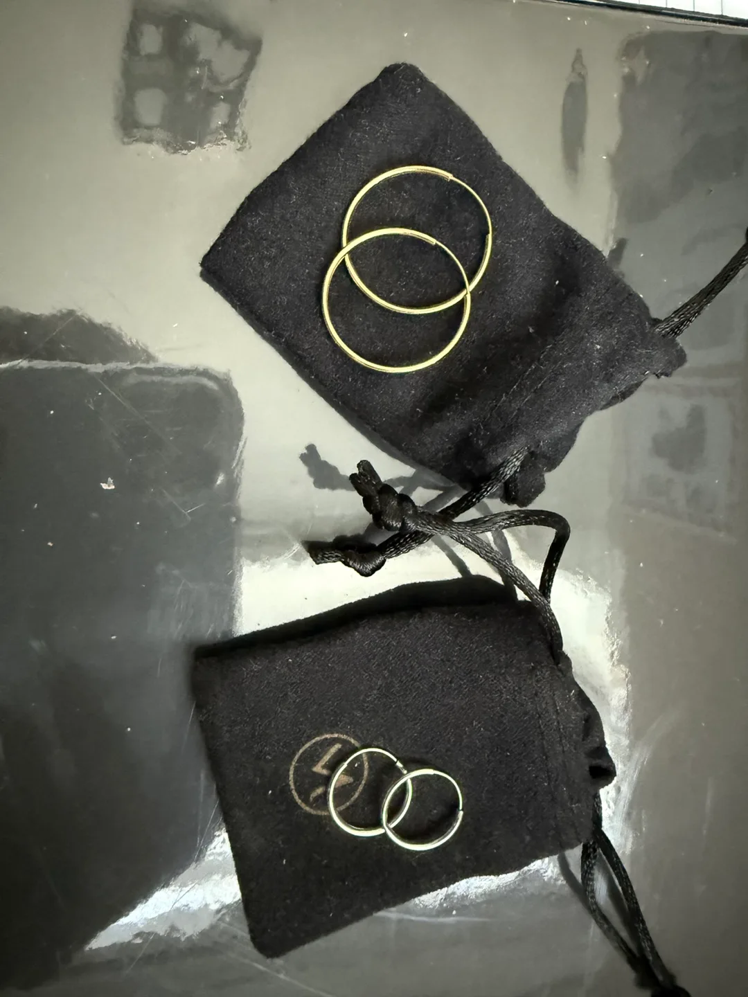 Two Pairs of Gold and white gold Hoop Earrings image indicator(2)