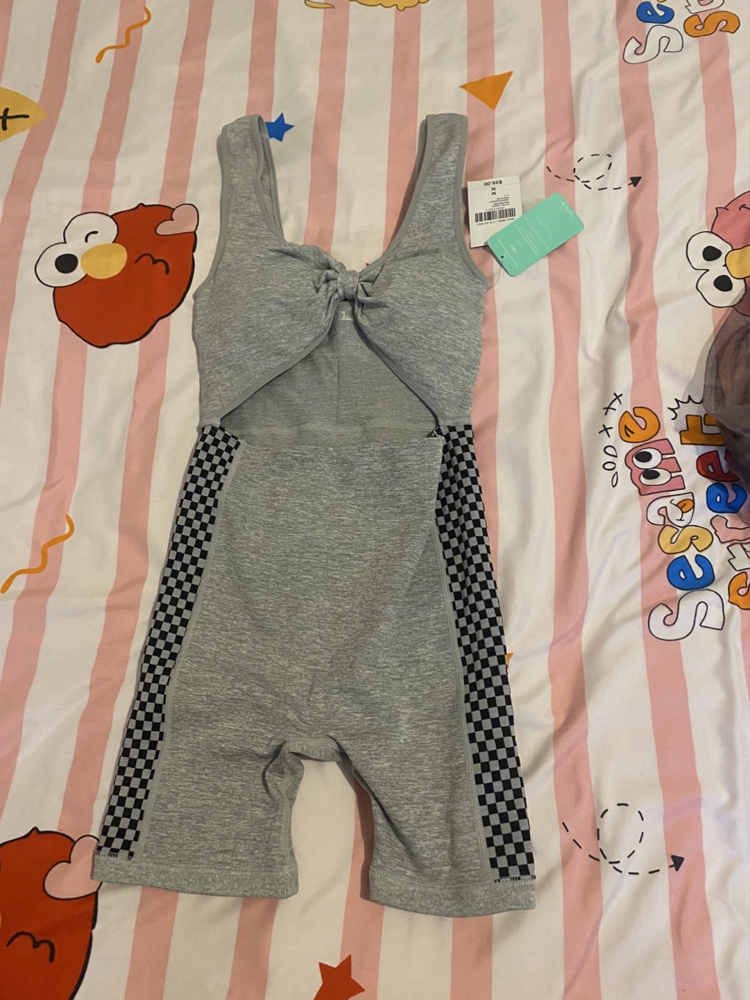 Three Women's Clothing Items: Jumpsuit, Bodysuit, and Knit Set