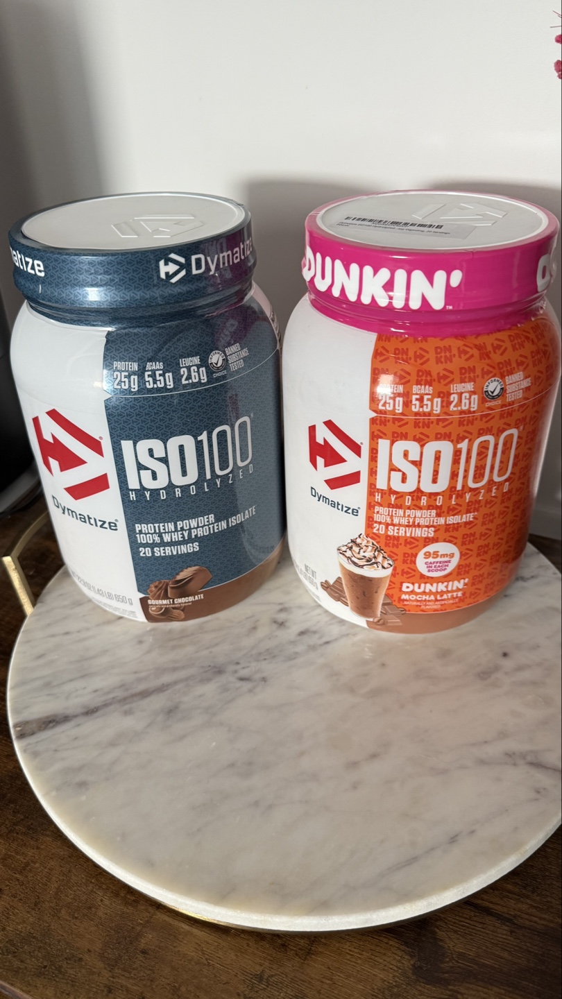 Two tubs of Dymatze ISO100 Hydrolyzed Protein Powder