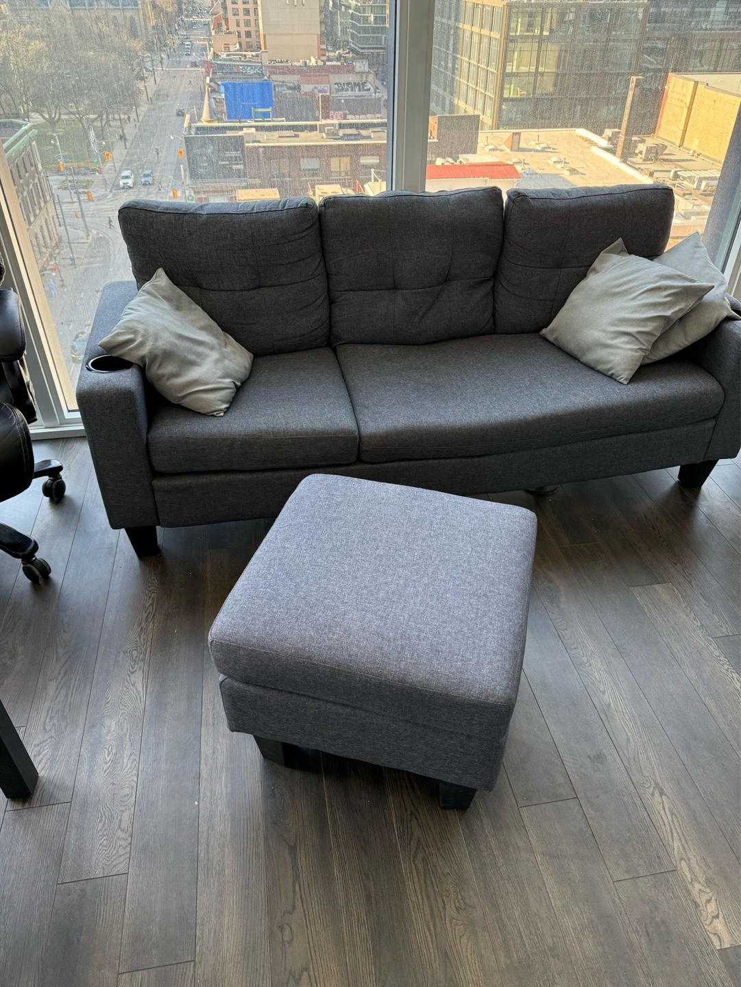 Grey sectional sofa with matching ottoman