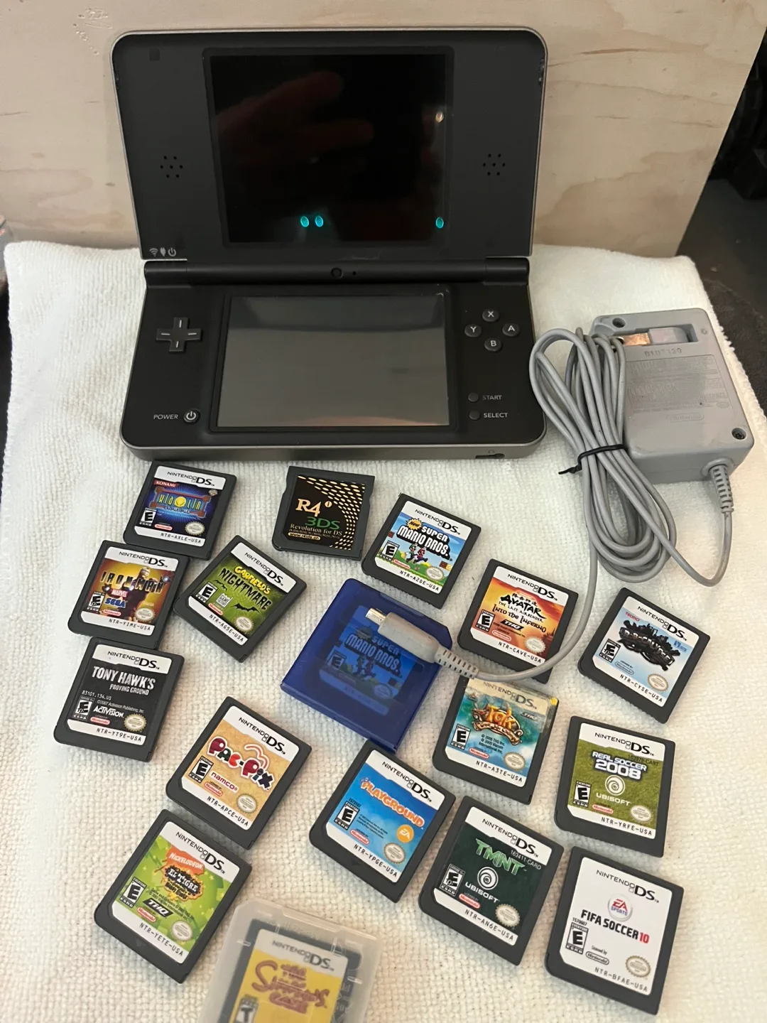 Nintendo DS Lite with 15 Games + Charger image indicator(5)