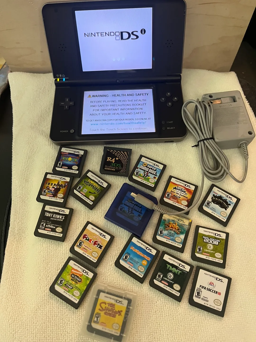 Nintendo DS Lite with 15 Games + Charger image indicator(2)