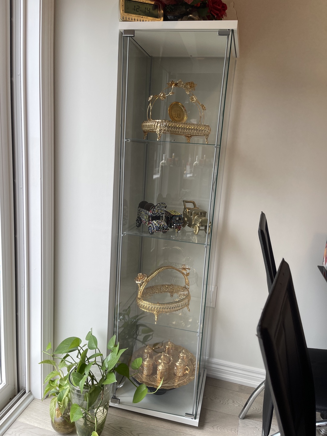 Glass curio cabinet with shelves