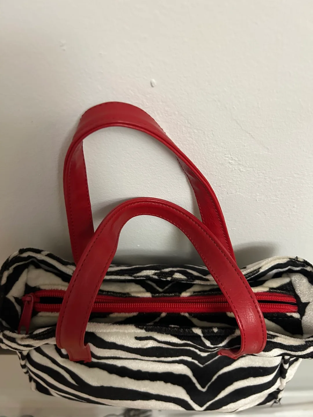 Zebra Print Handbag with Red Accents image indicator(2)