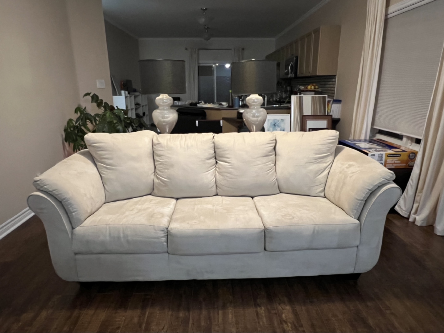 SOLD: Beige three-seater sofa