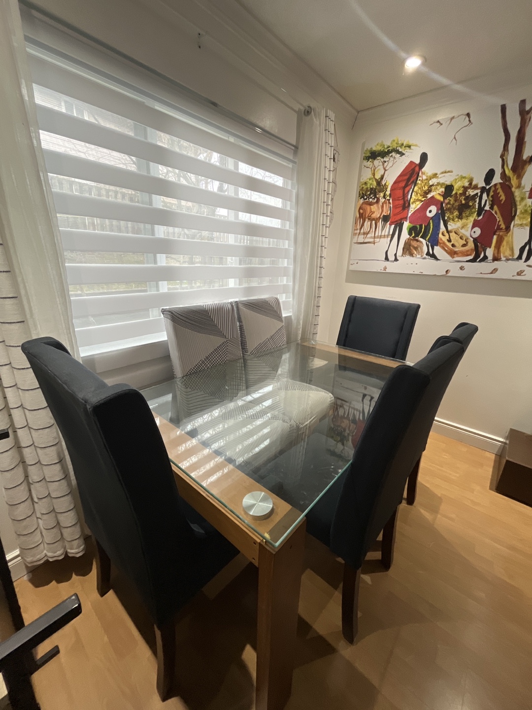Glass top dining table with four chairs