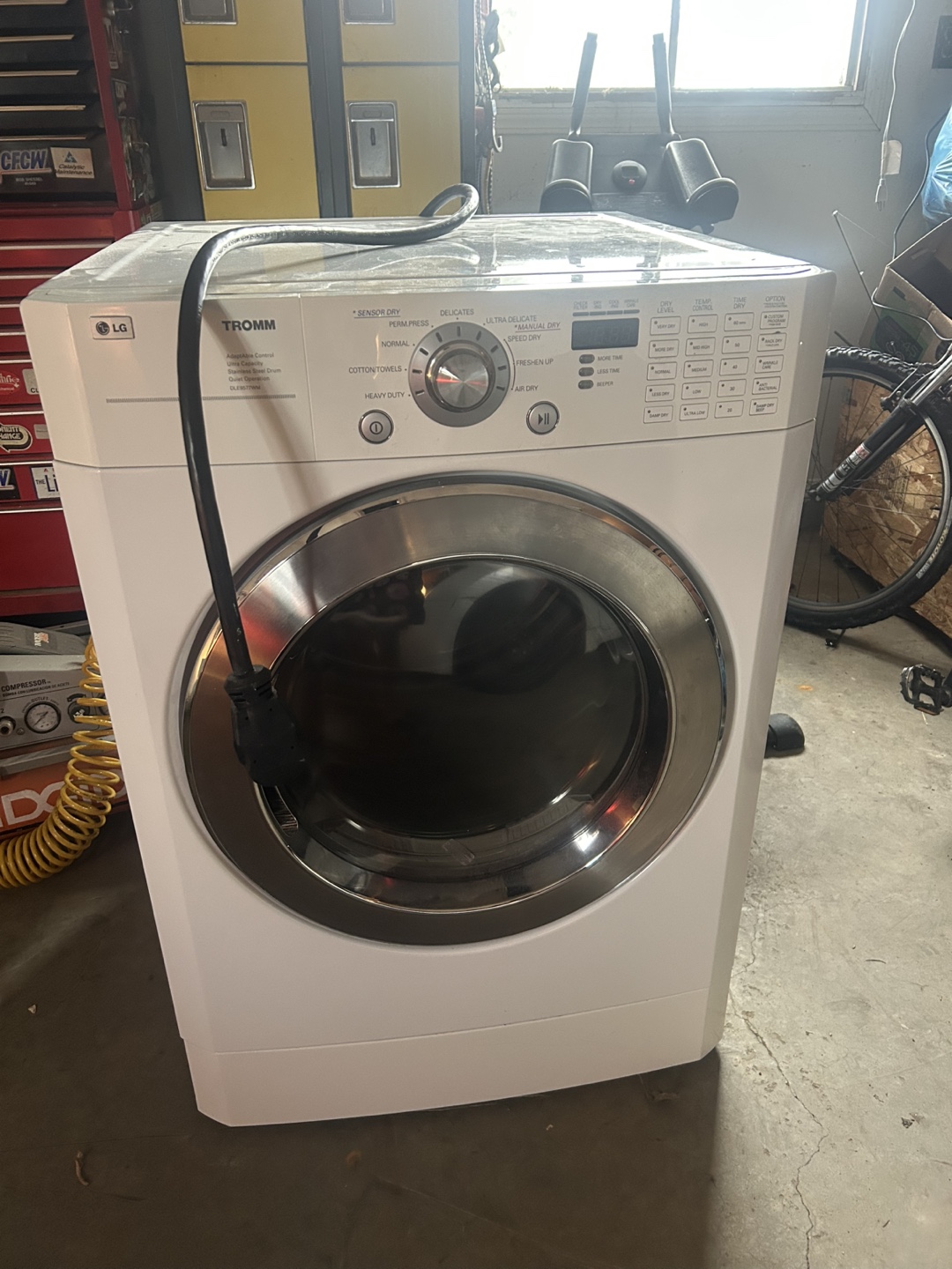 LG Tromm Electric Dryer and Whirlpool Washer