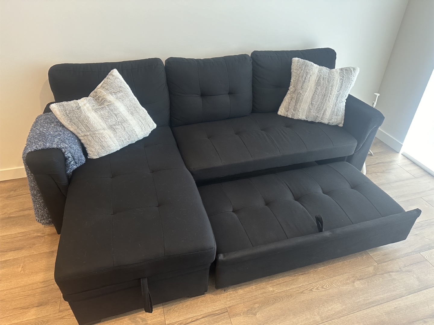 Black Sectional Sofa with Pull-Out Sleeper