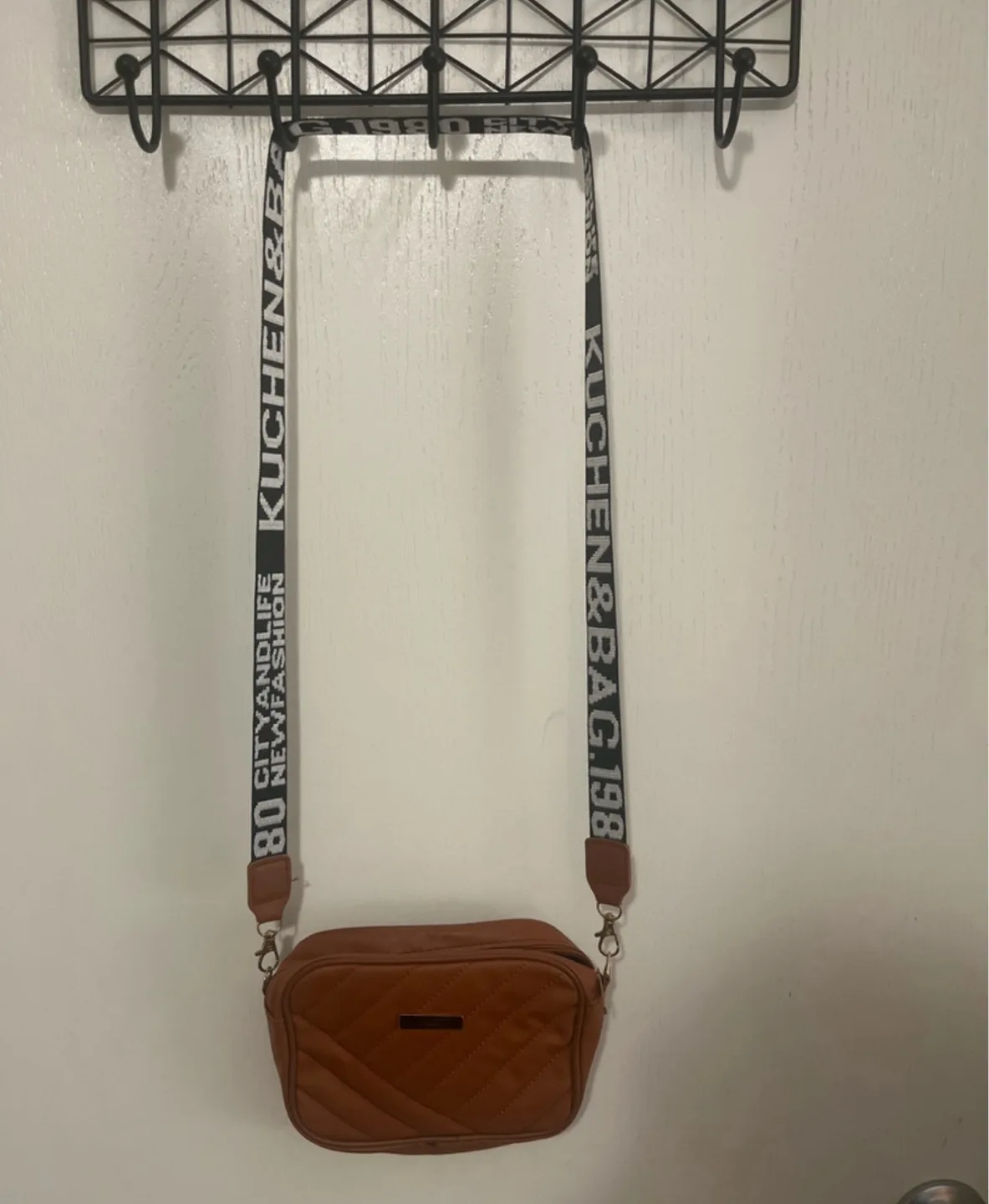 Brown quilted crossbody bag with custom strap image indicator(3)