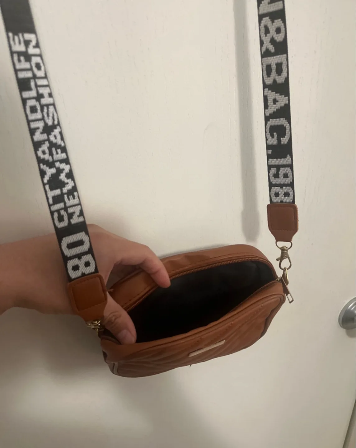 Brown quilted crossbody bag with custom strap image indicator(2)