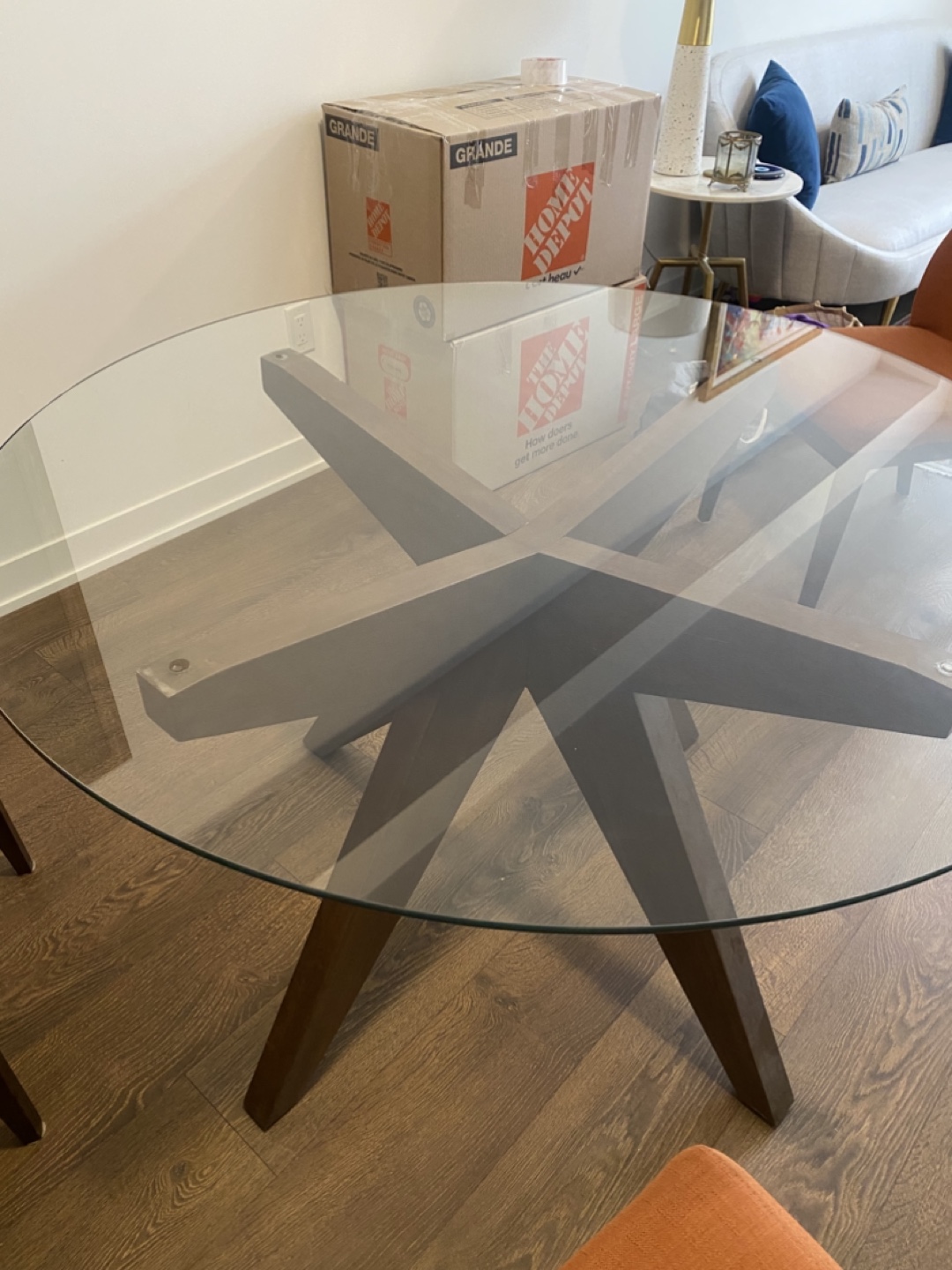 Eq3 Glass Top Dining Table with Structube Four Orange Chairs