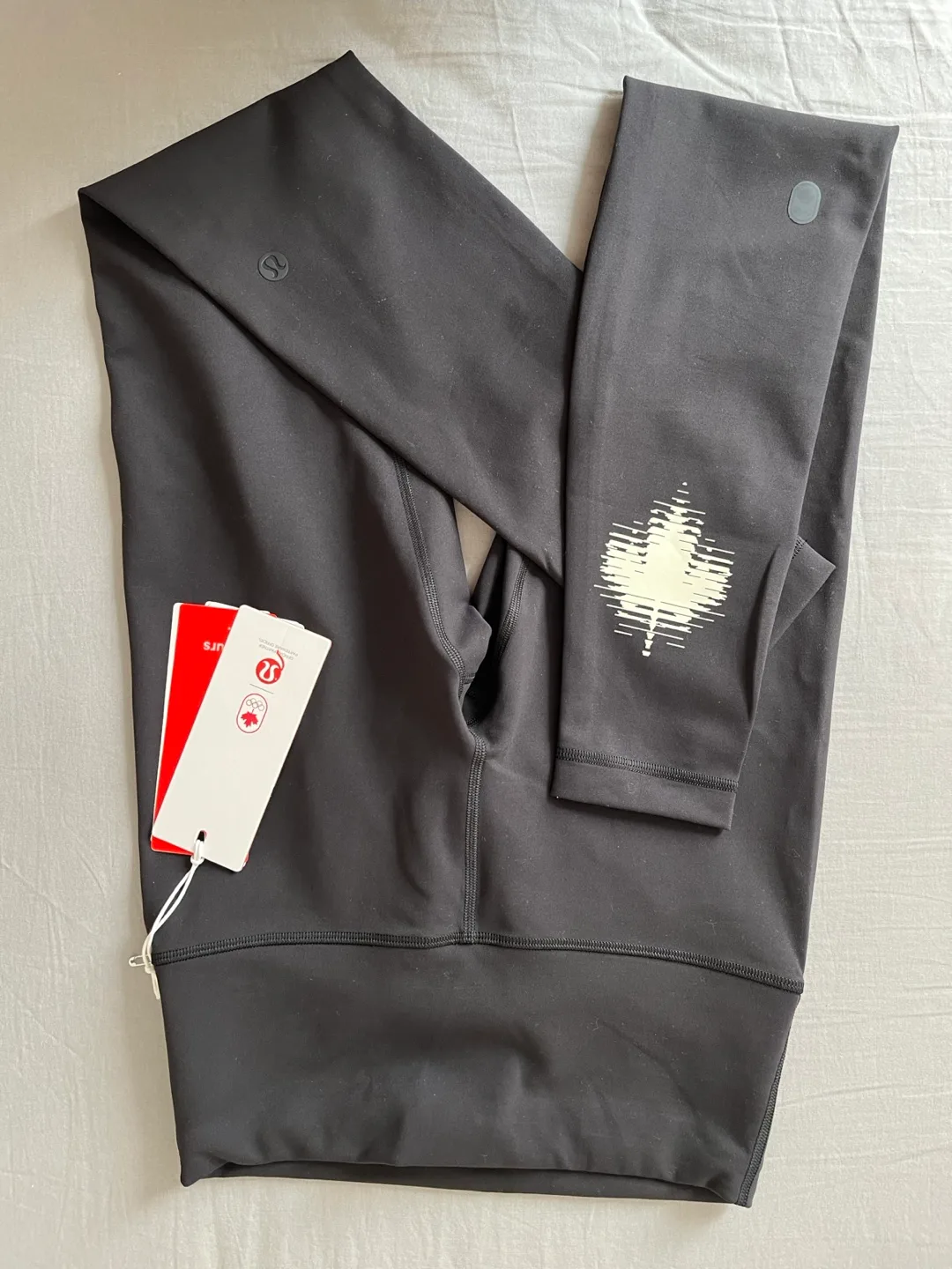 Lululemon Black High-Rise Leggings with Maple Leaf Graphic image indicator(3)
