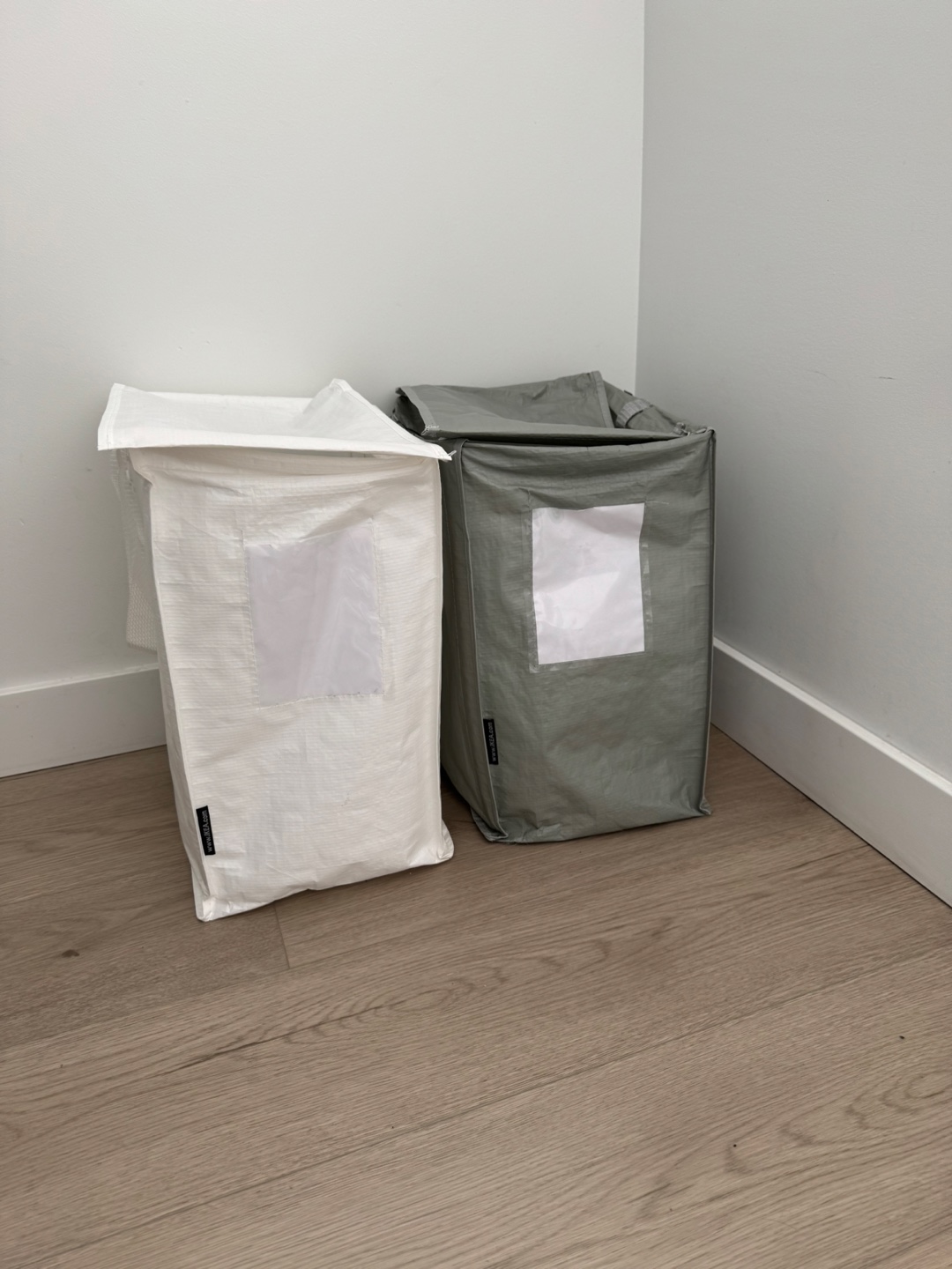 Pair of IKEA RISATORP laundry baskets
