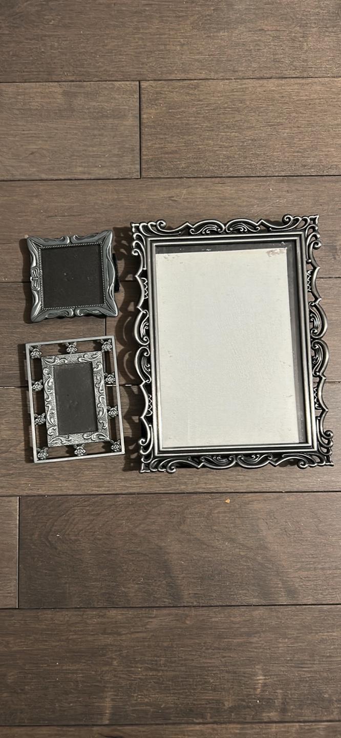 Set of three ornate silver picture frames