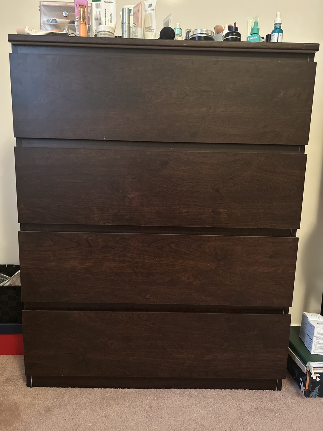 Dark brown four-drawer dresser