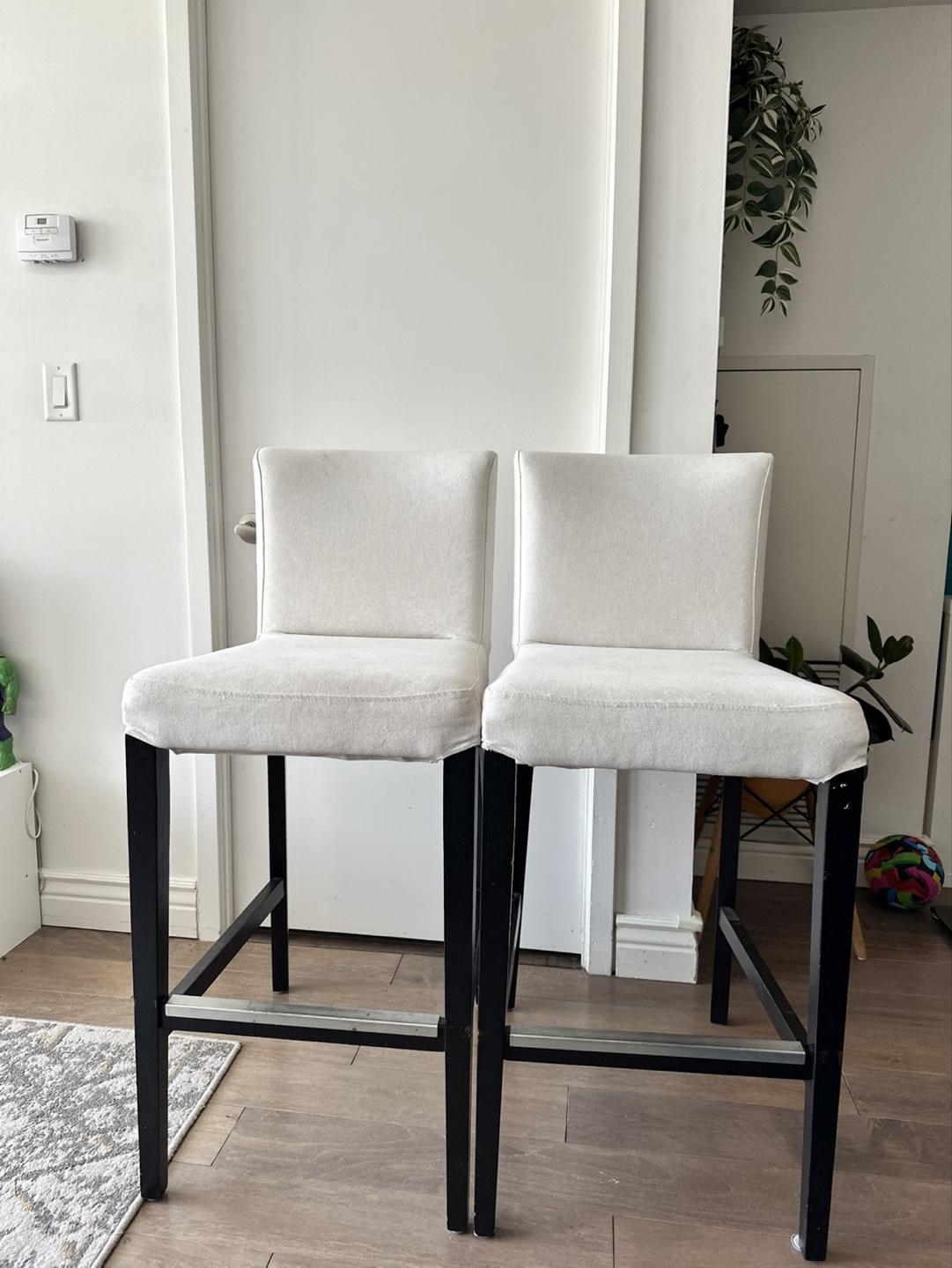 Two IKEA HENRIKSDAL white chairs