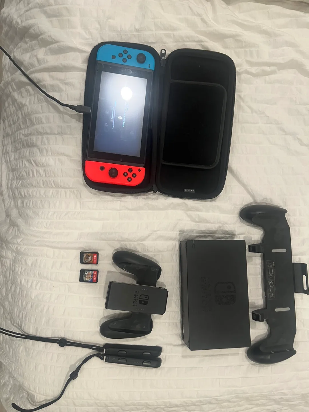 Nintendo Switch with Grip, Case, and Games image indicator(3)