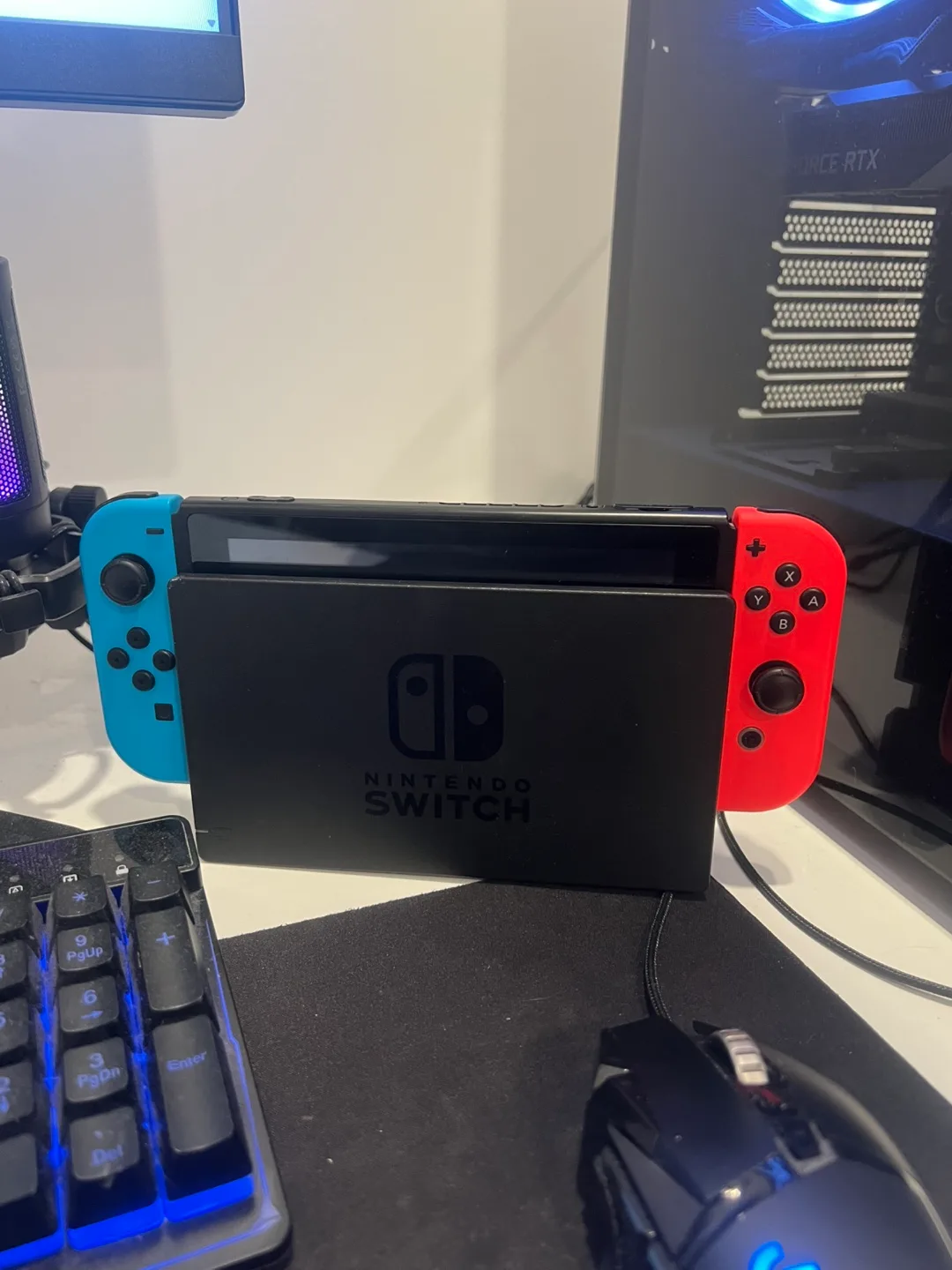 Nintendo Switch with Grip, Case, and Games image indicator(2)