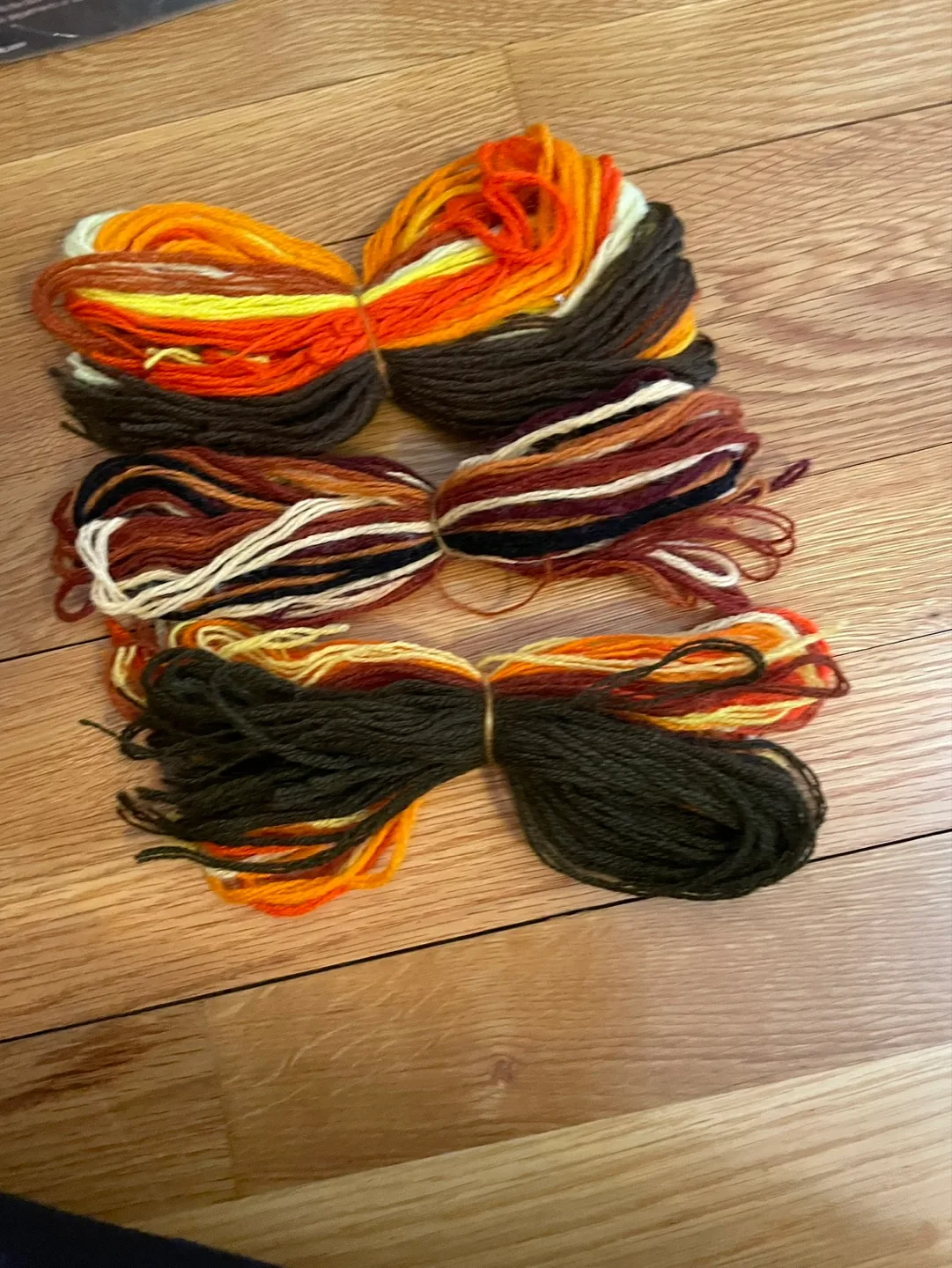 Three Bundles of Autumn-Colored Yarn thumbnail