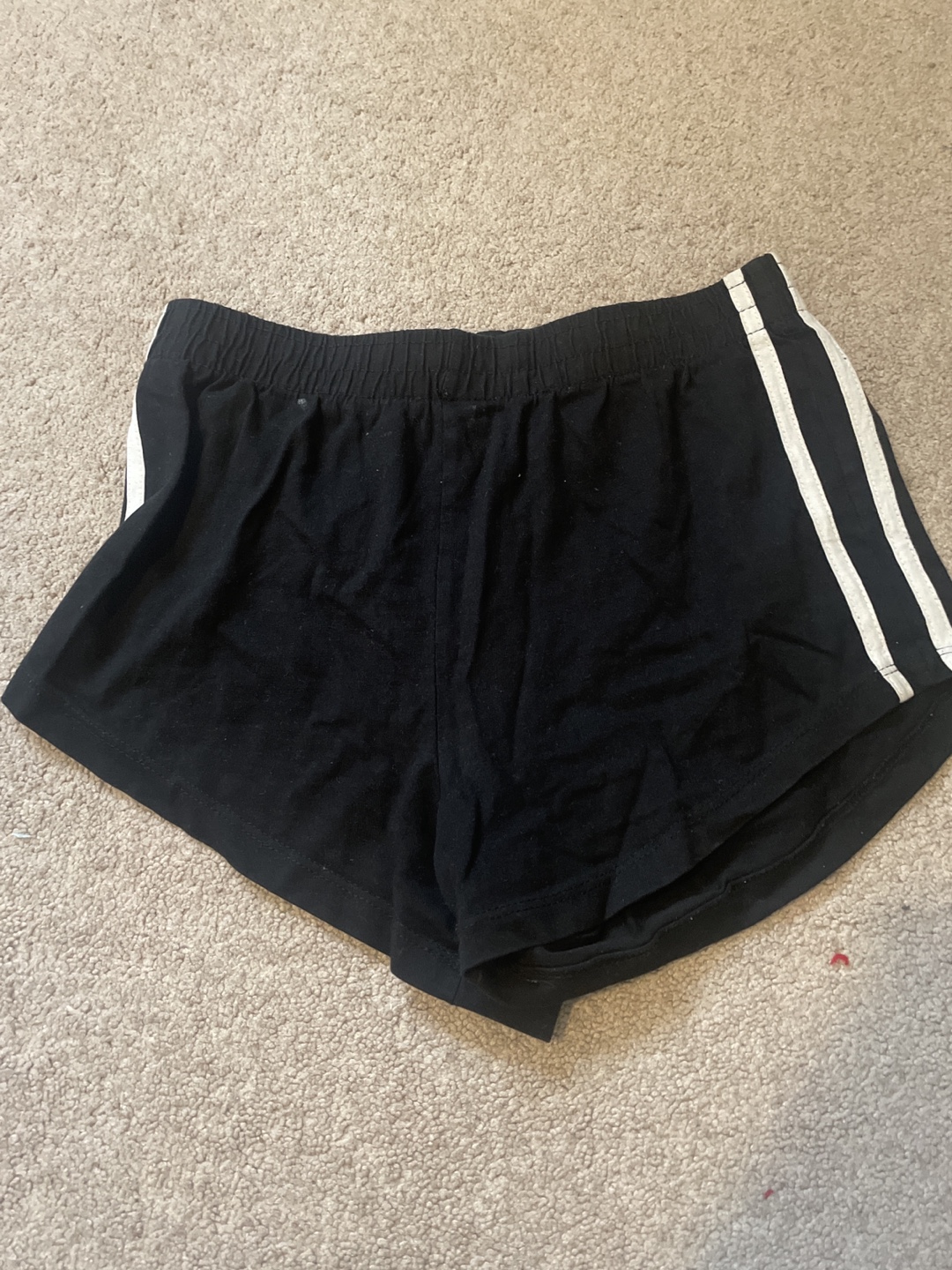 Black shorts with white stripes