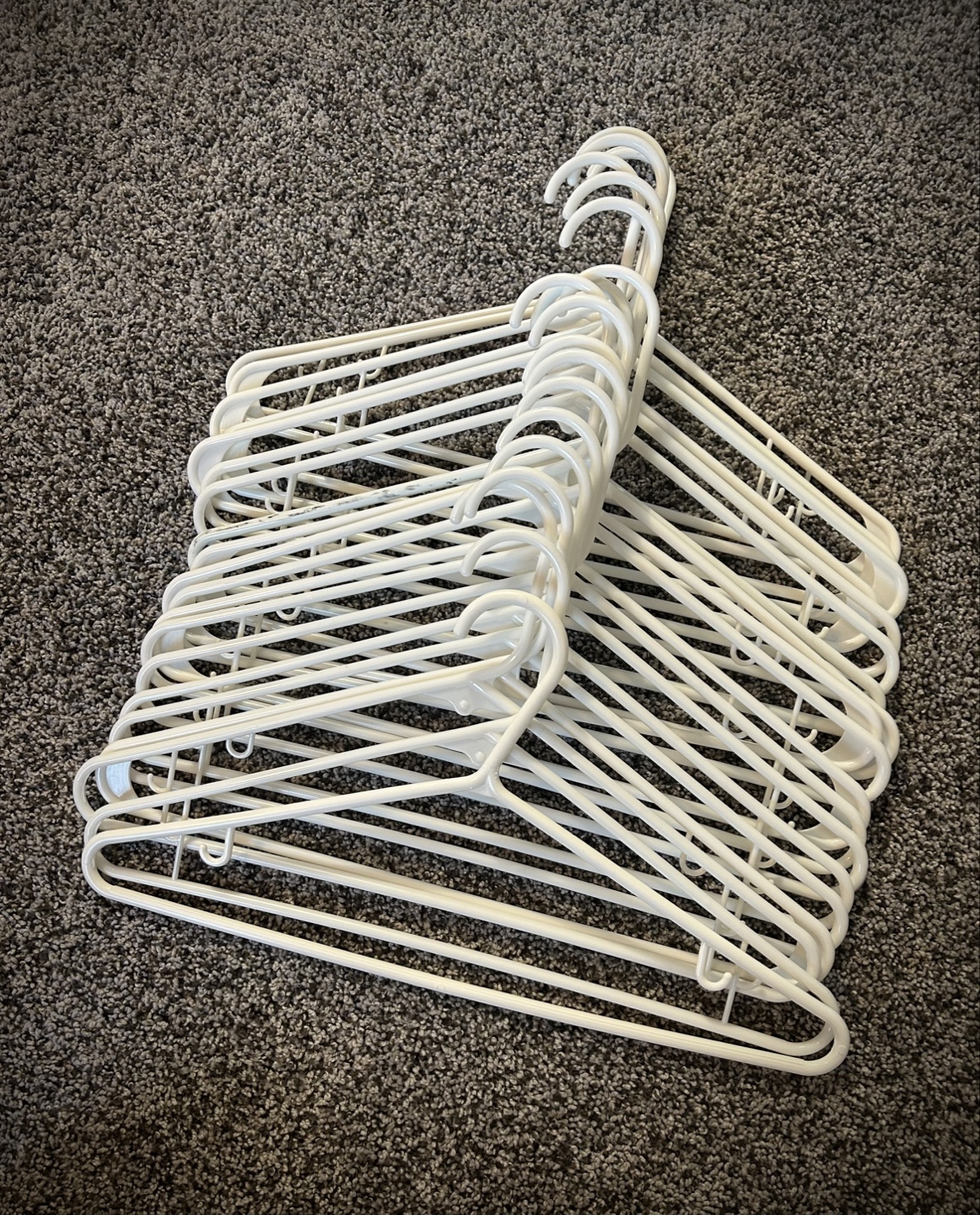 Bulk lot of white plastic hangers