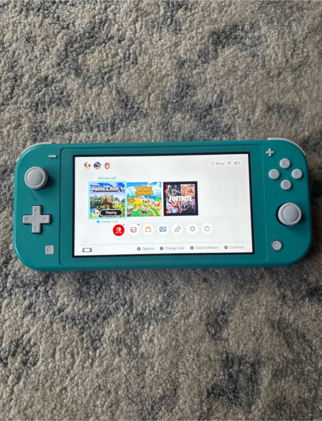 Teal Nintendo Switch Lite with Animal Crossing