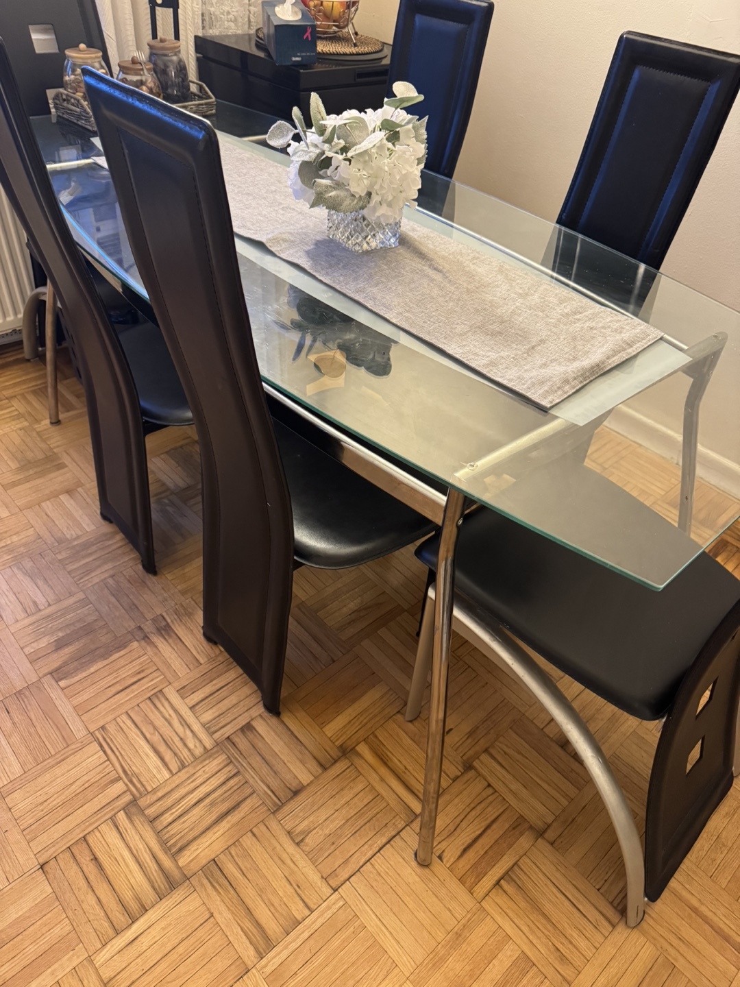 Glass dining table and four chairs