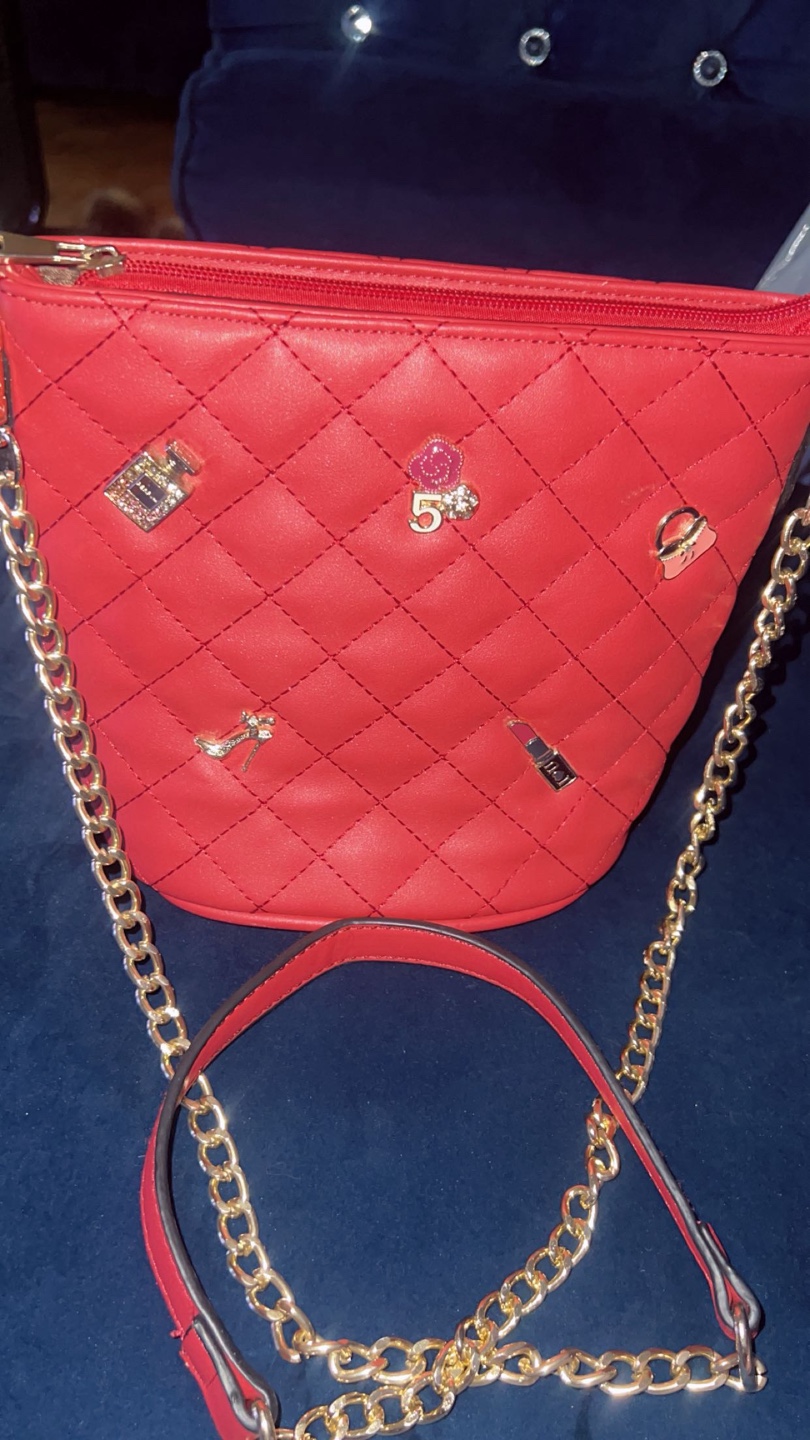 Red quilted crossbody bag with gold chain strap