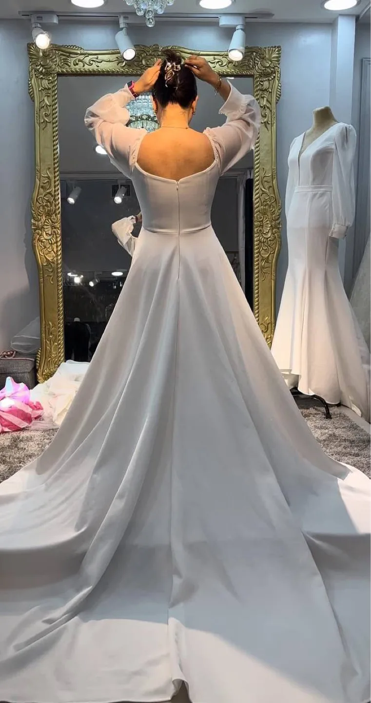 Elegant Long-Sleeve White Wedding Gown thumbnail