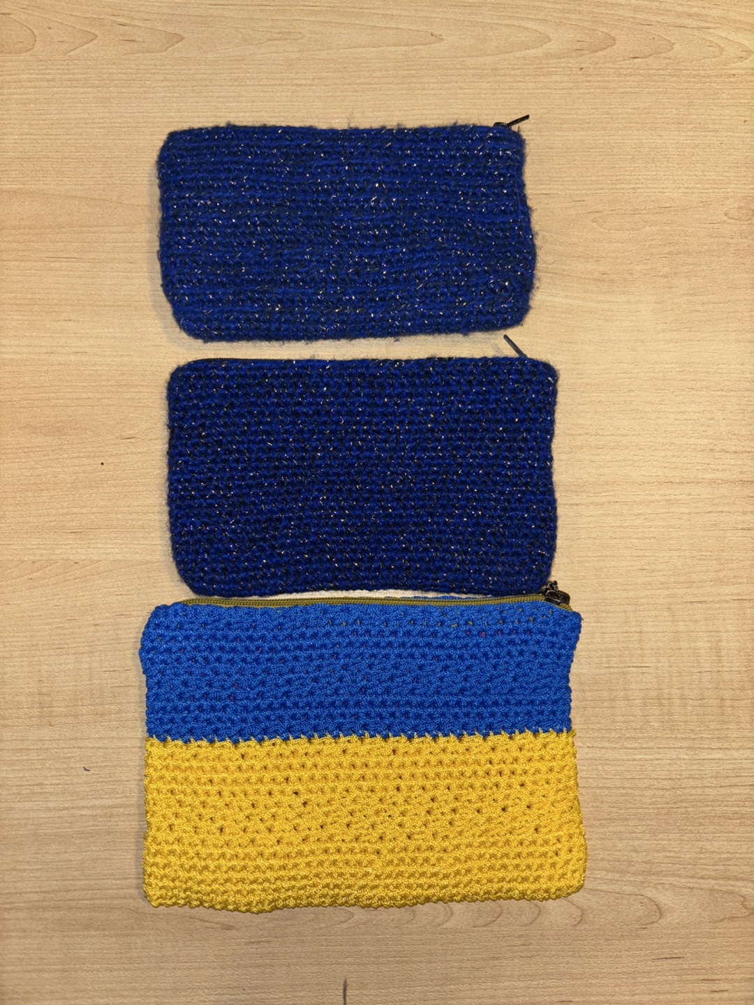 Five handmade crocheted zipper pouches