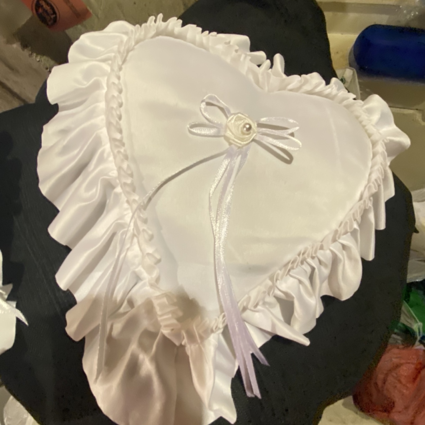 White heart-shaped ring bearer pillow
