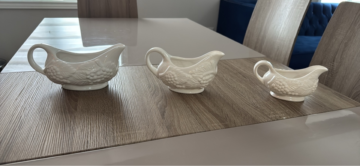 Set of three white ceramic gravy boats