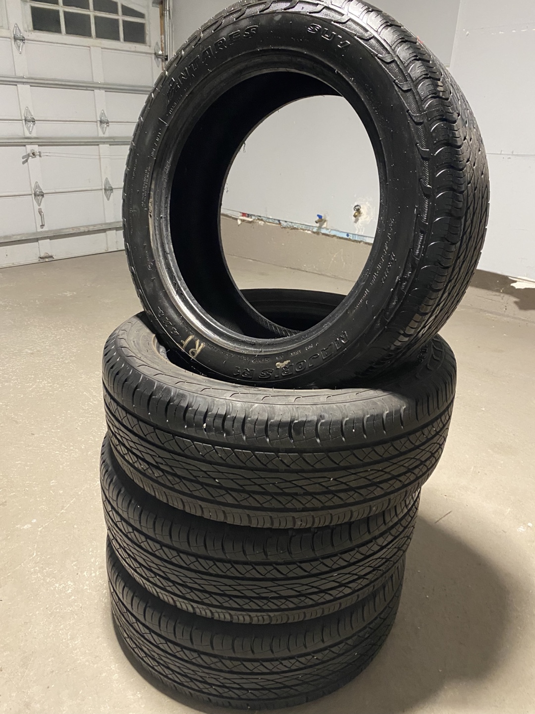Used 235/55R18 100V All-Season Tires - Set of Four - photo 2