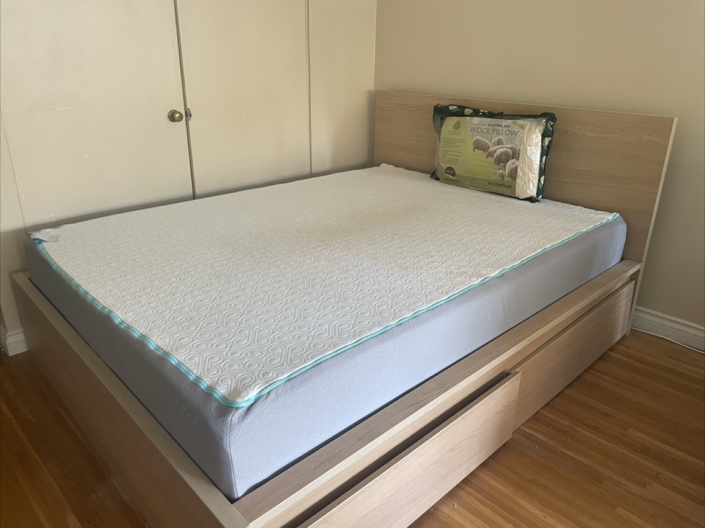 Queen-sized bed frame with two drawers