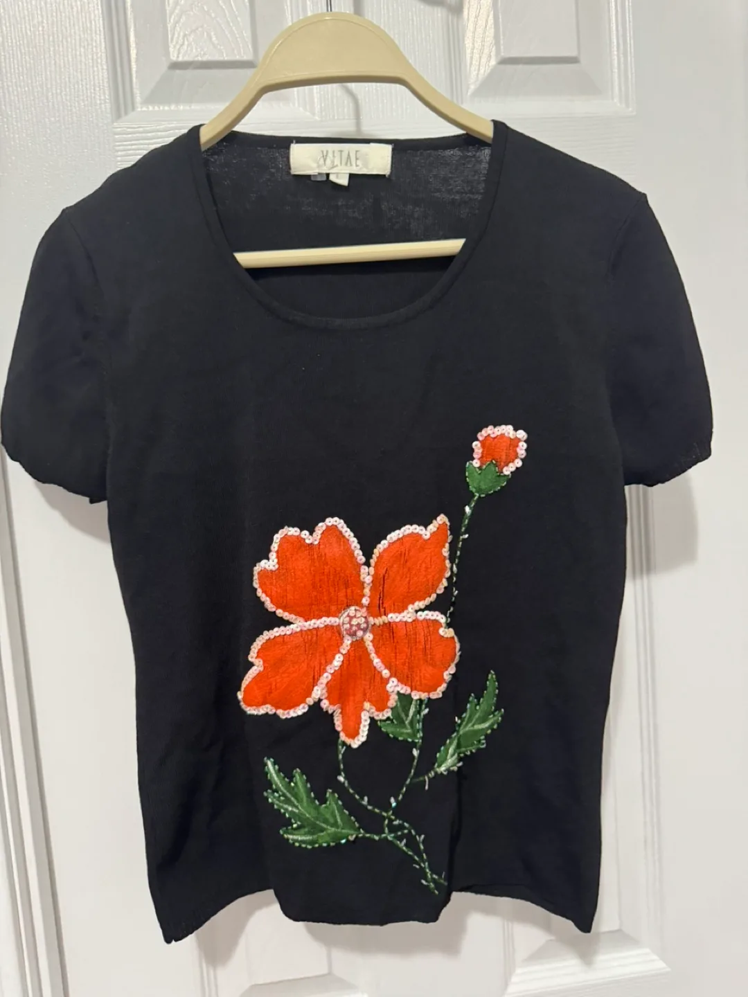 Vitae Black Knit Top with Orange Flower Detail thumbnail