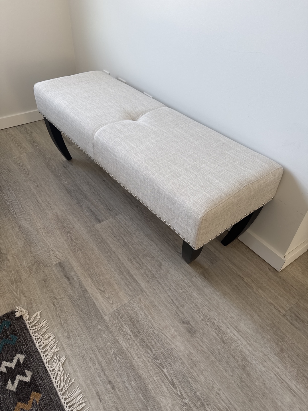 Beige Upholstered Bench with Dark Legs