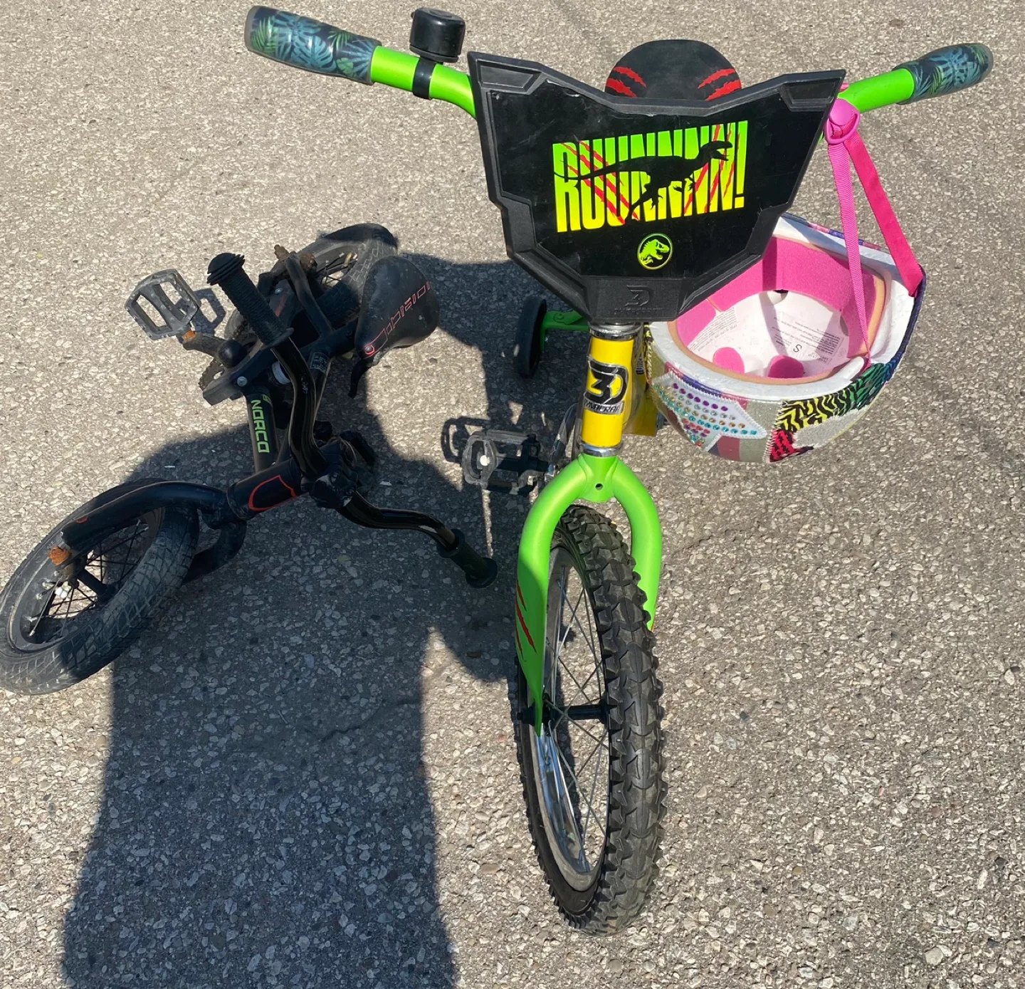 Two Kids' Bikes - One Yellow Velociraptor, One Black Norco image indicator(2)