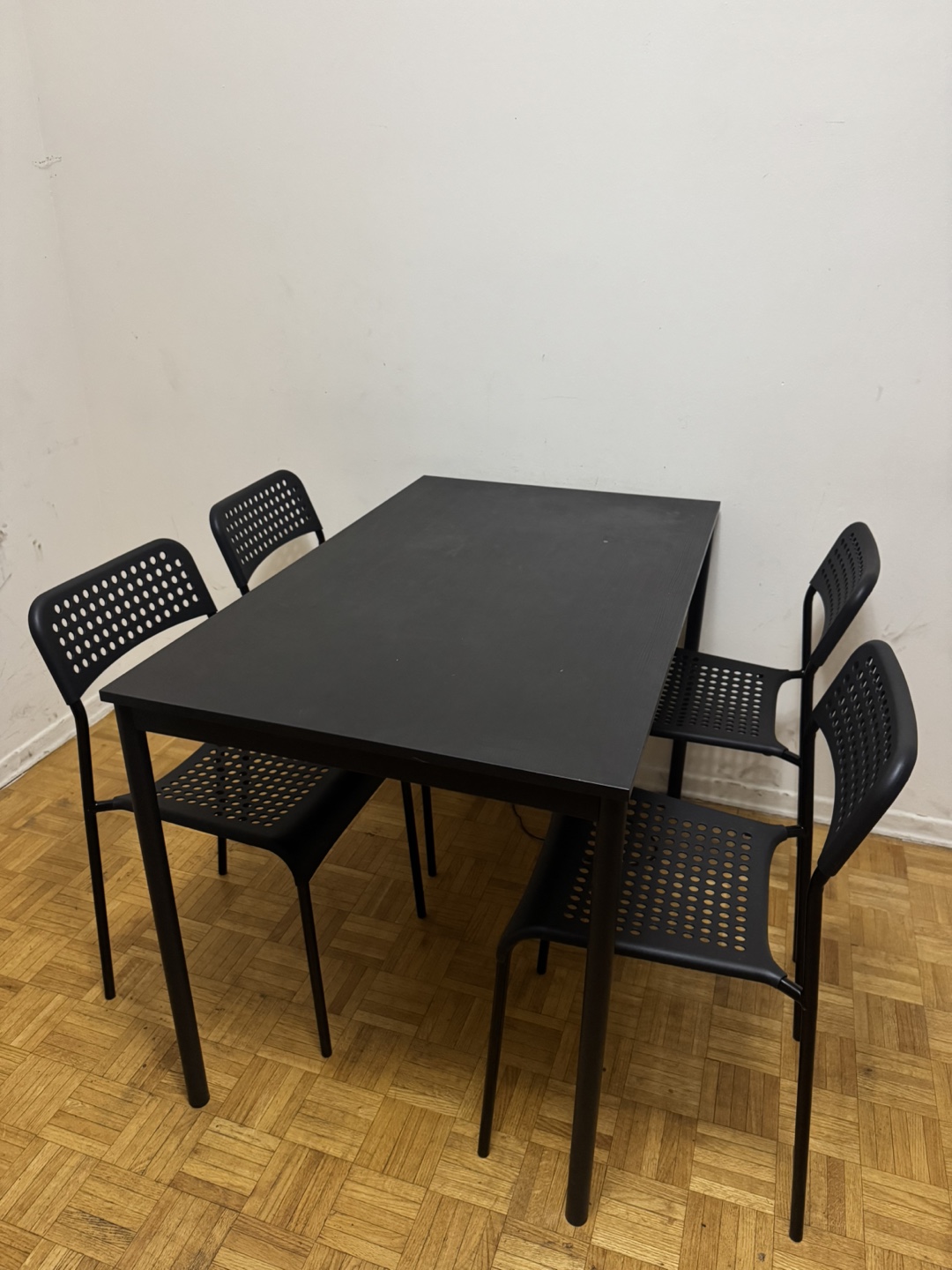 Black dining table and four chairs set