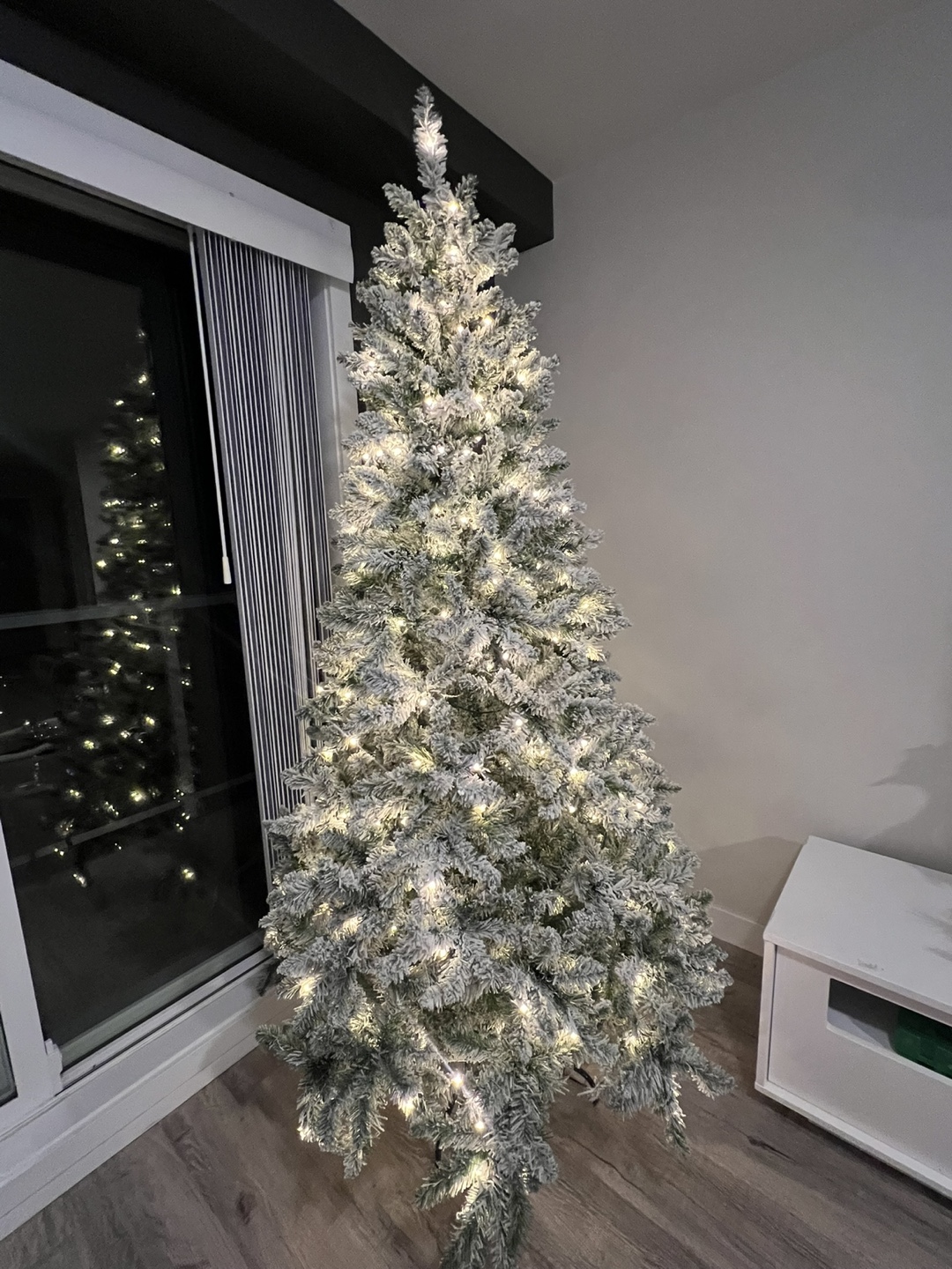 Pre-lit flocked artificial Christmas tree