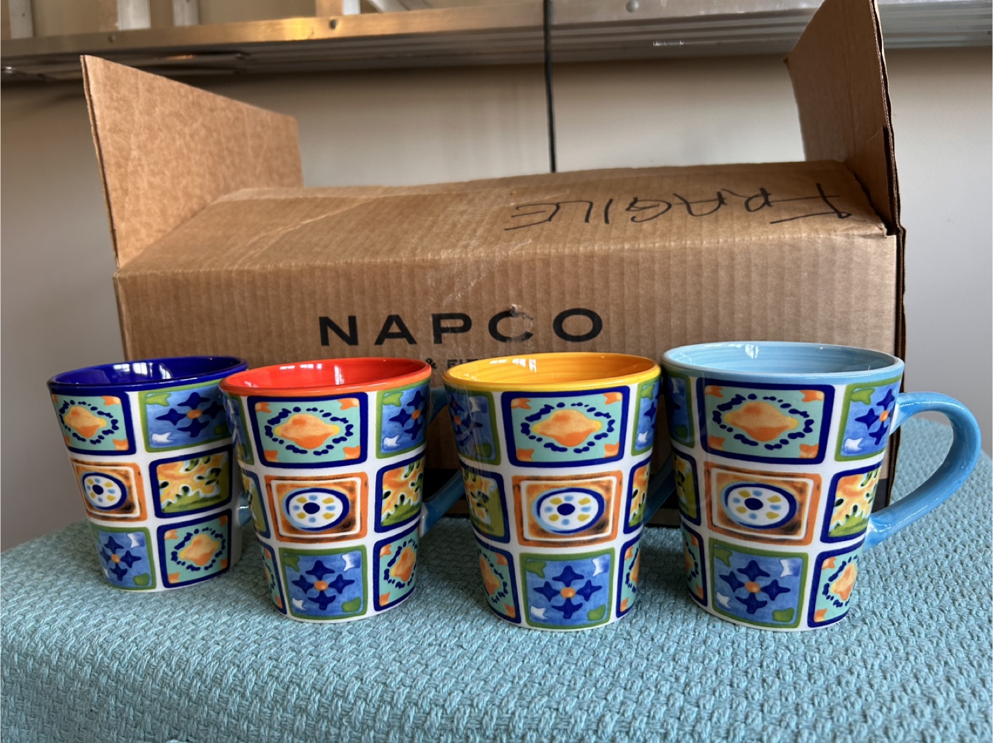 Set of four colourful mugs