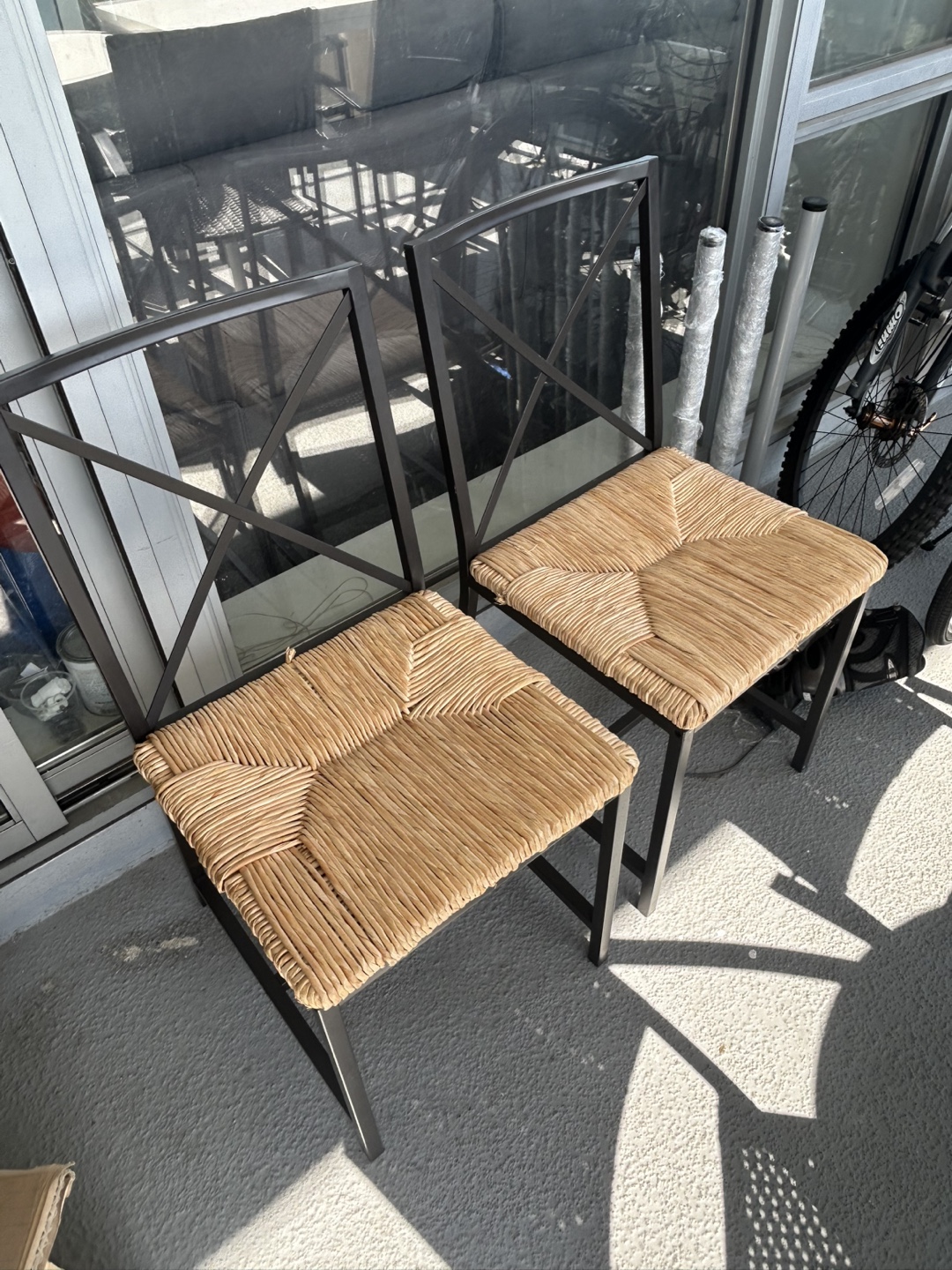 Pair of Woven Rattan Chairs with Black Metal Frame