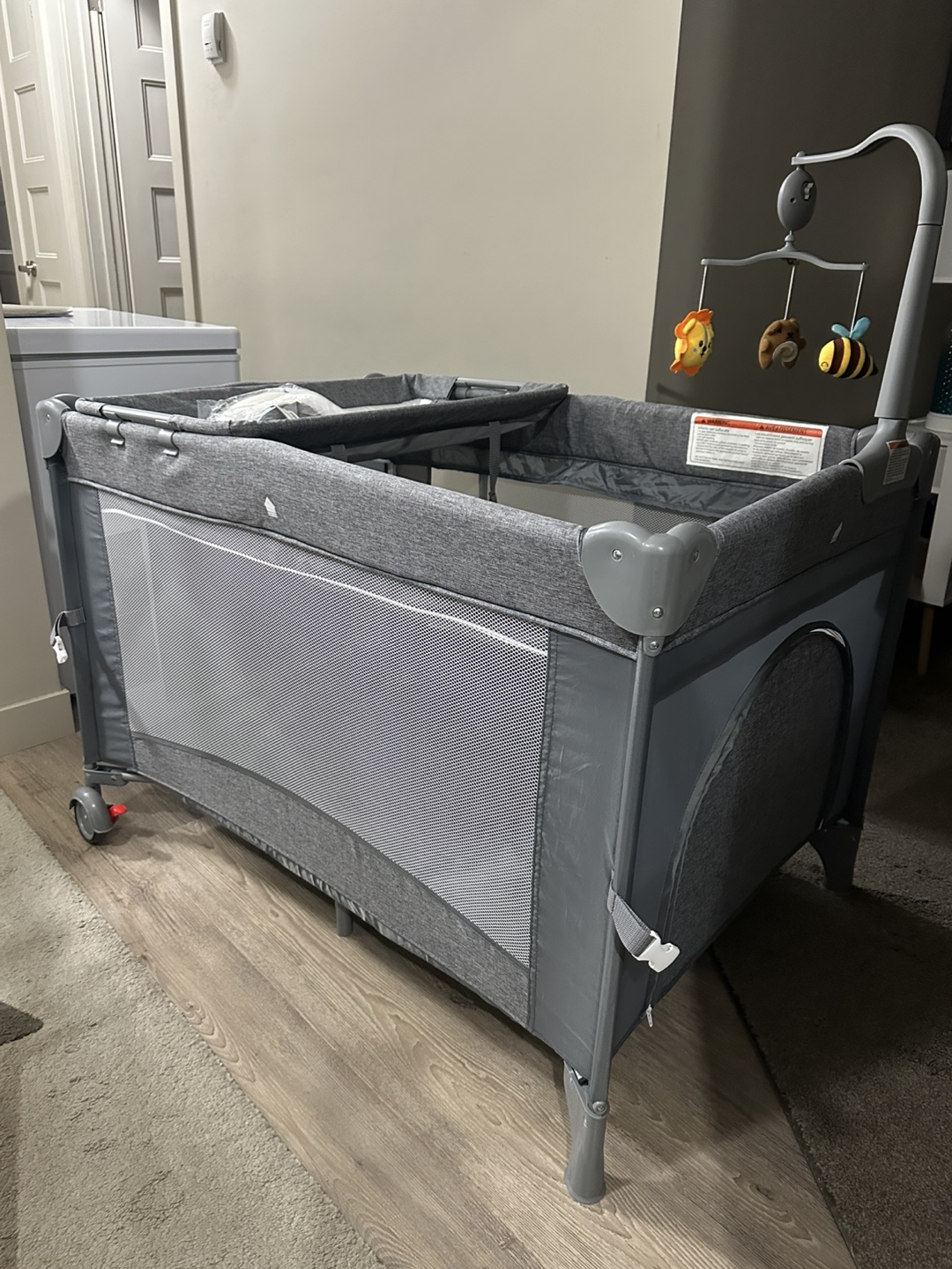 Brand-new, never-used playard-style crib, oversized