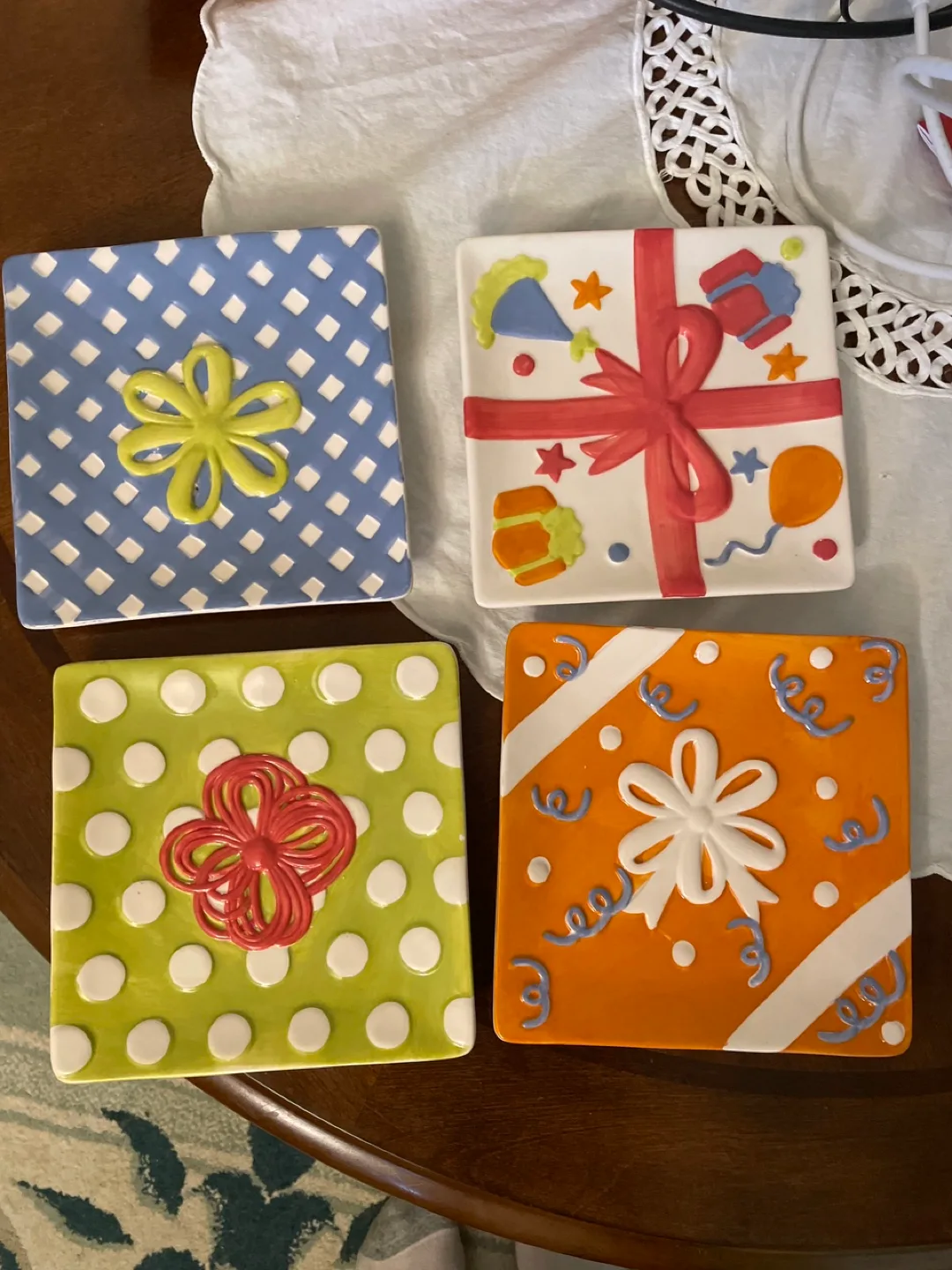 Set of four colourful square decorative plates thumbnail