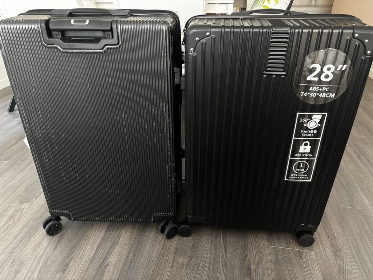 Pair of 28" Black Suitcases
