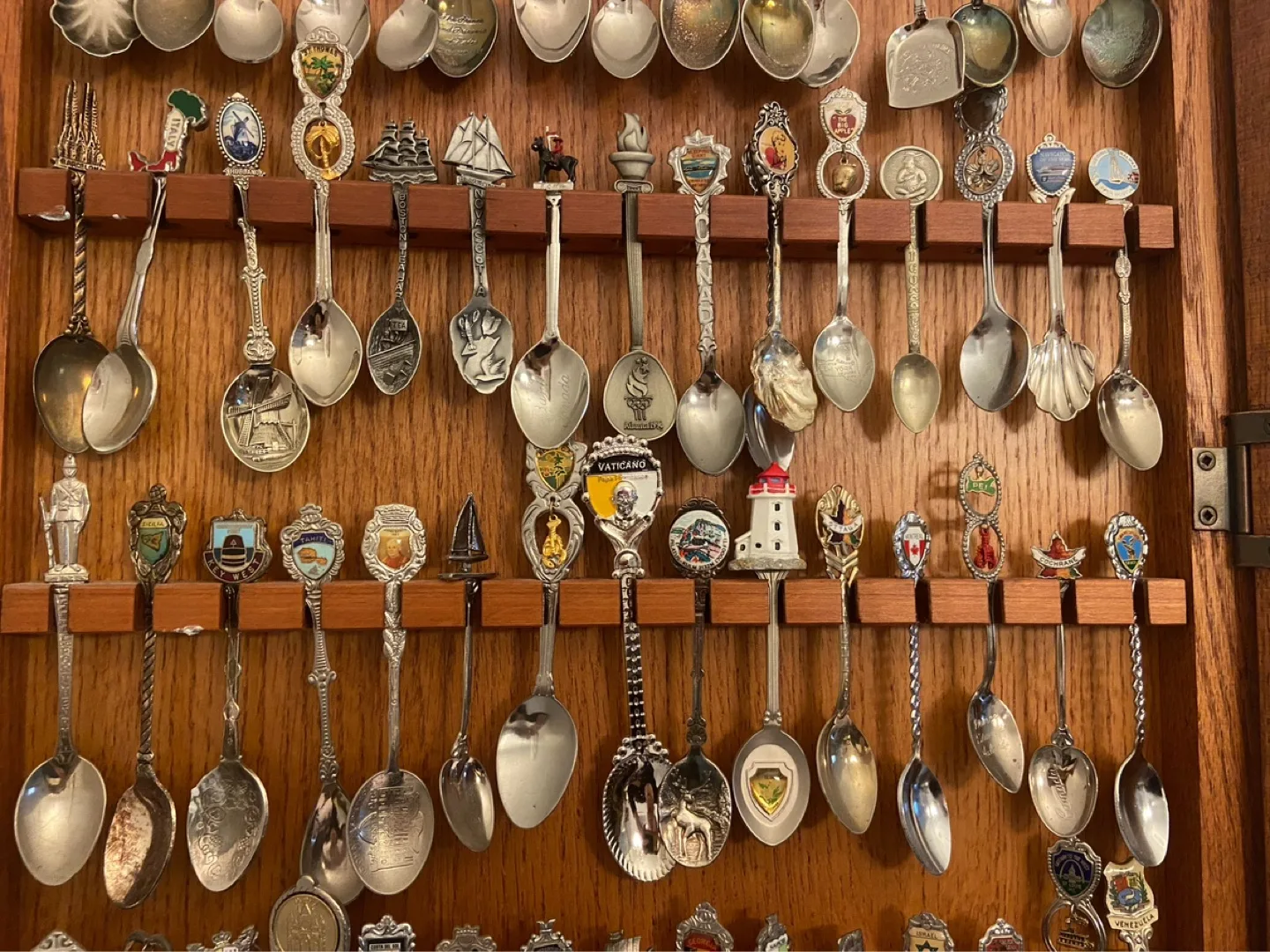 Large Collection of Souvenir Spoons in Wooden Display Case image indicator(6)