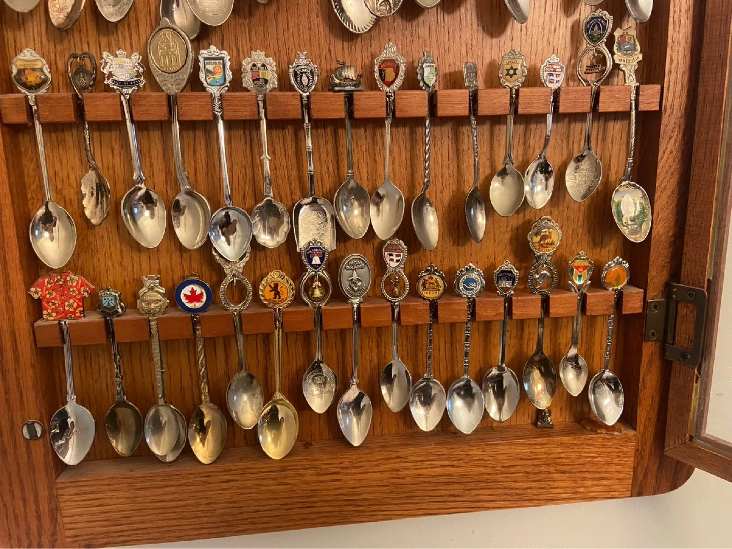 Large Collection of Souvenir Spoons in Wooden Display Case image indicator(4)