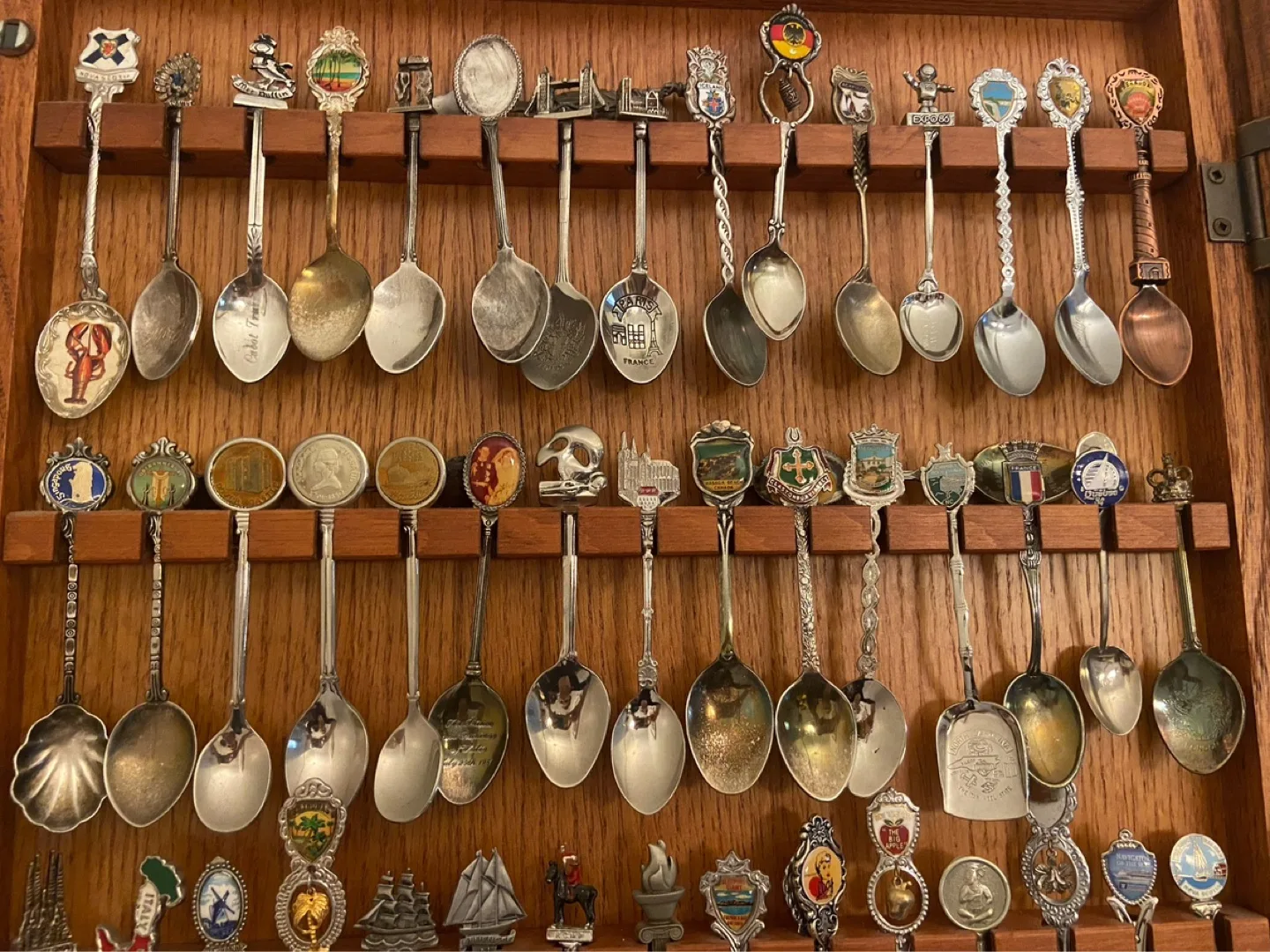 Large Collection of Souvenir Spoons in Wooden Display Case image indicator(7)