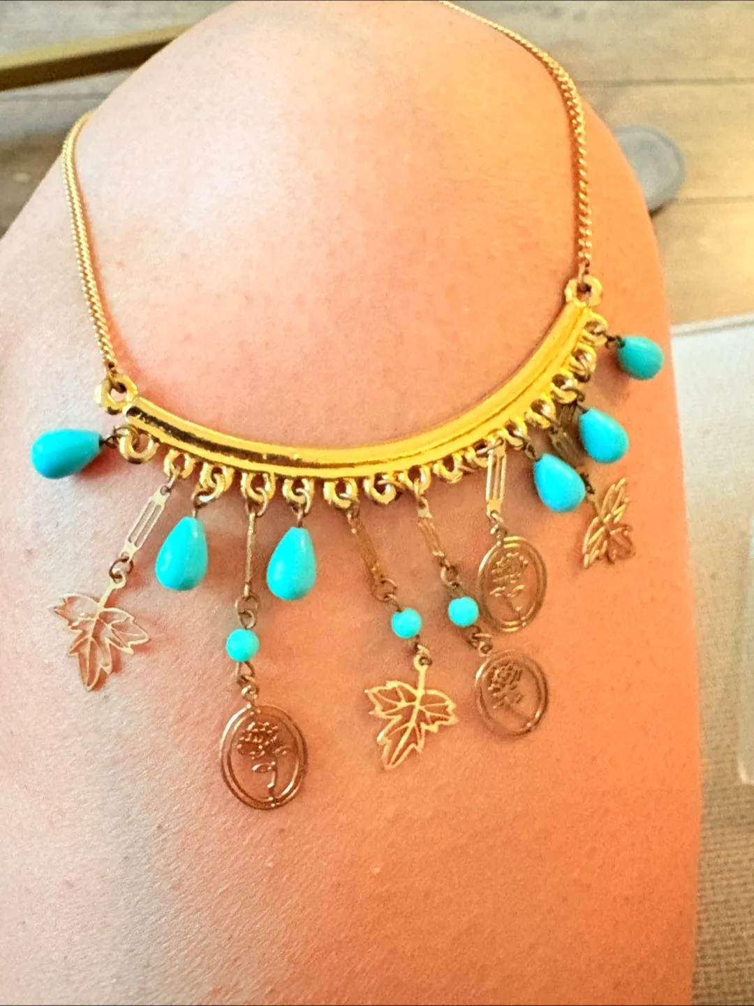 Gold statement necklace with turquoise accents thumbnail